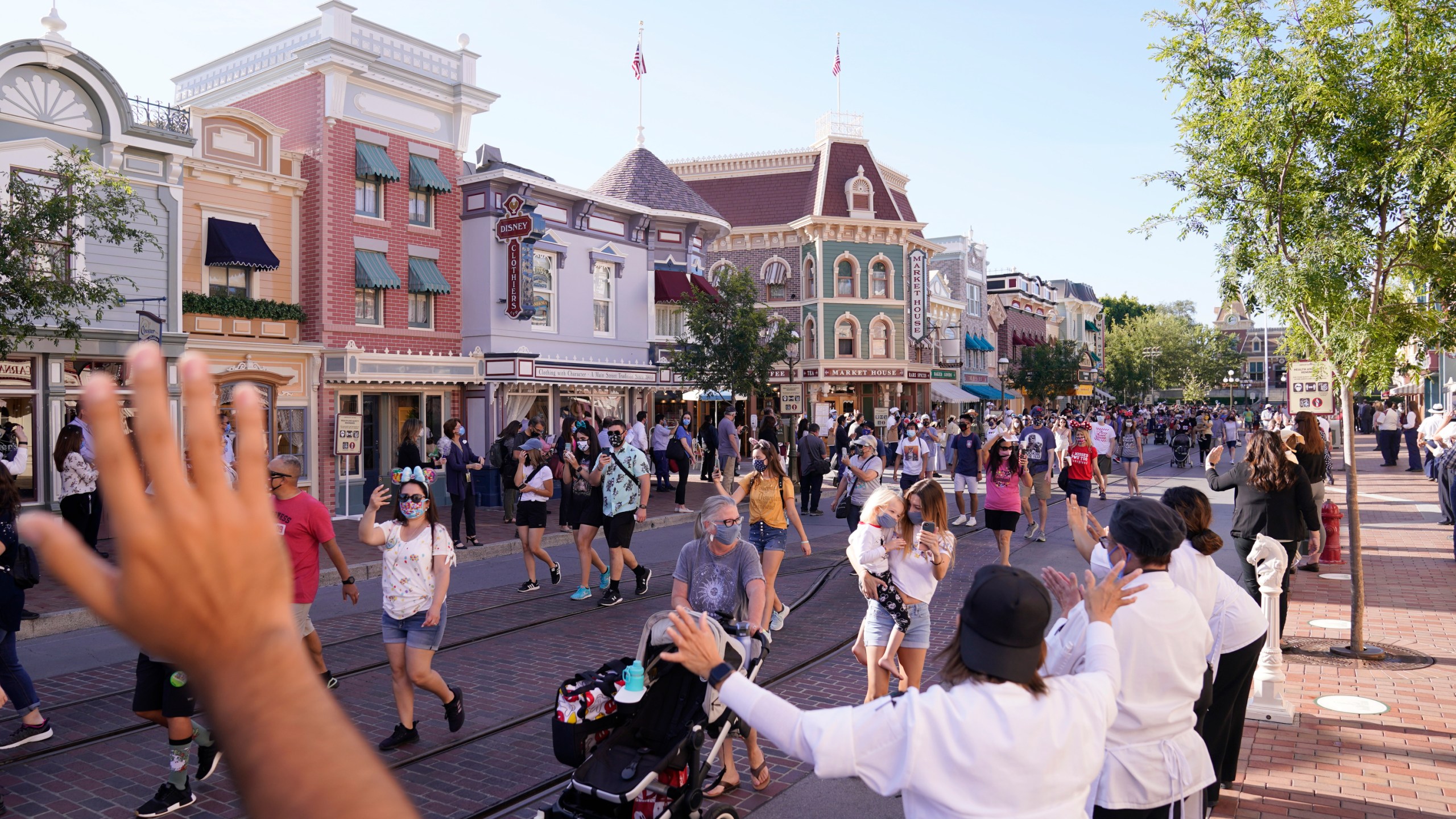 In this April 30, 2021, file photo, guests walk down Main Street USA at Disneyland in Anaheim. (AP Photo/Jae Hong, File)