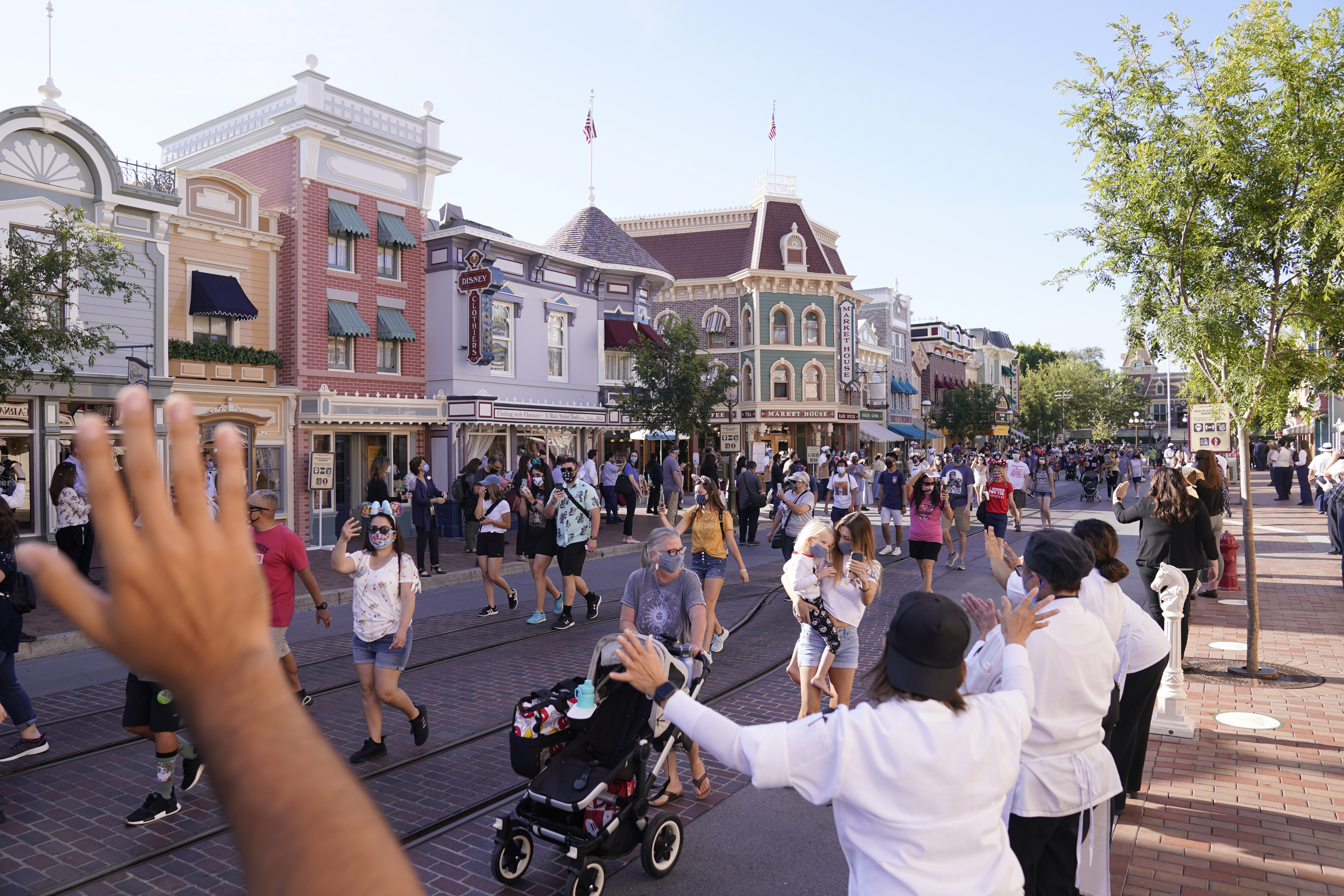 In this April 30, 2021, file photo, guests walk down Main Street USA at Disneyland in Anaheim. (AP Photo/Jae Hong, File)