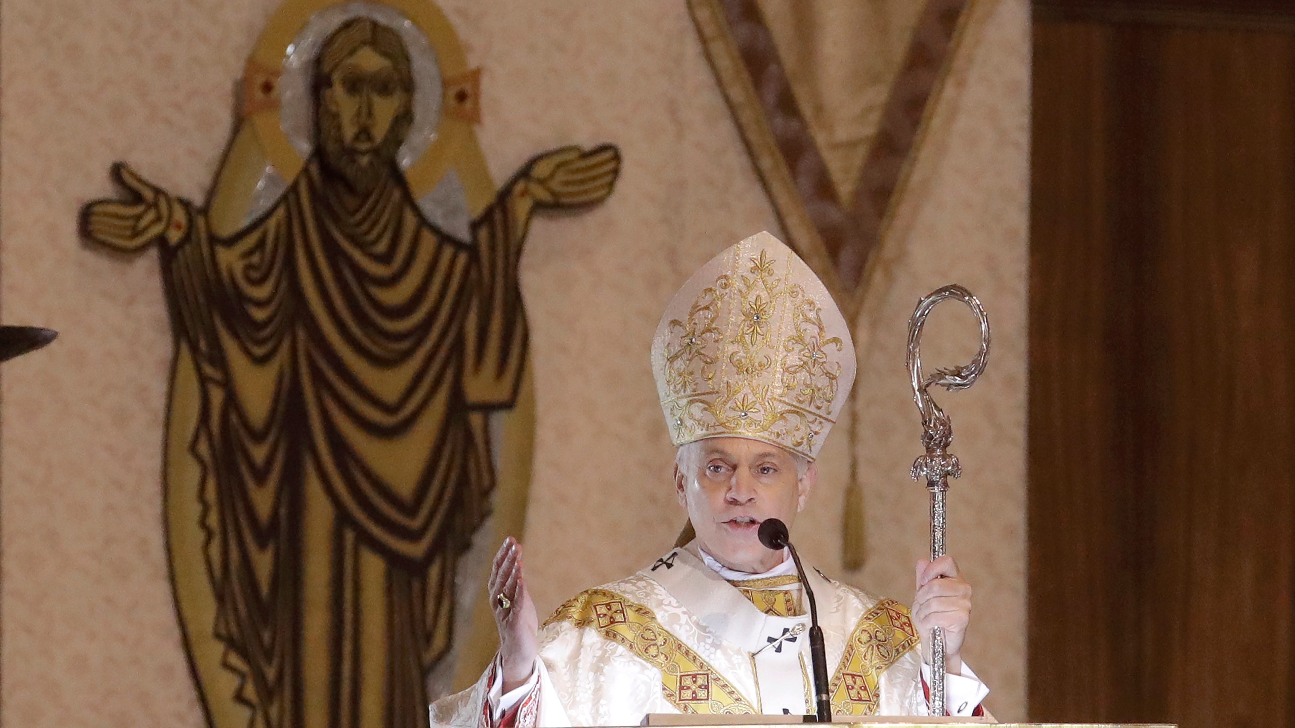 In this Sunday, April 12 2020 photo, San Francisco Archbishop Salvatore Cordileone celebrates Easter Mass, which was live streamed, at St. Mary's Cathedral in San Francisco. Cordileone hopes his fellow bishops, at their upcoming national meeting in June, will agree to send a strong message of disapproval to Catholic politicians who advocate for abortion rights. (AP Photo/Jeff Chiu)