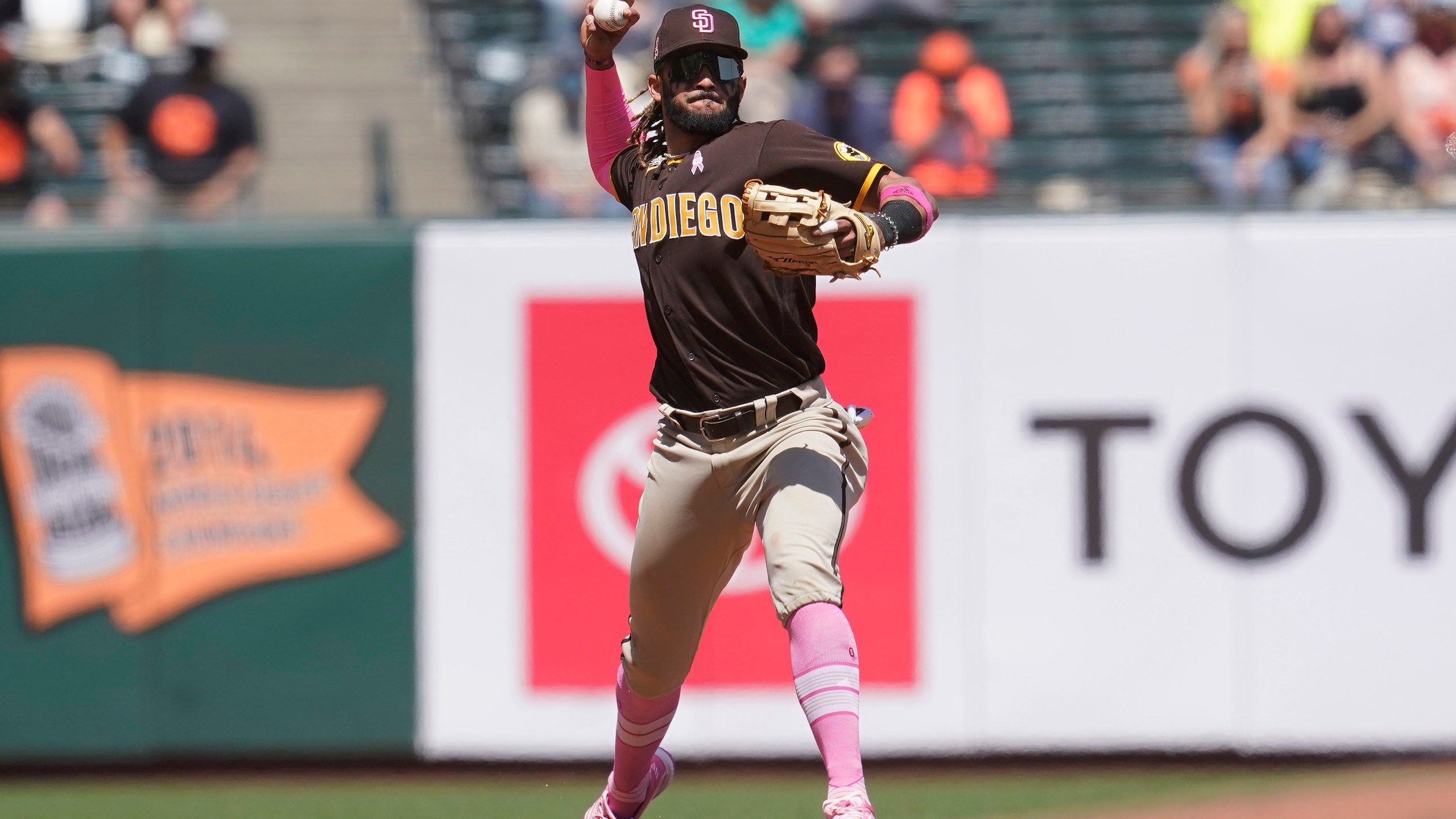 San Diego Padres shortstop Fernando Tatis Jr. throws out San Francisco Giants' Austin Slater at first base during the fifth inning of a baseball game in San Francisco on May 9, 2021. (Jeff Chiu / Associated Press)