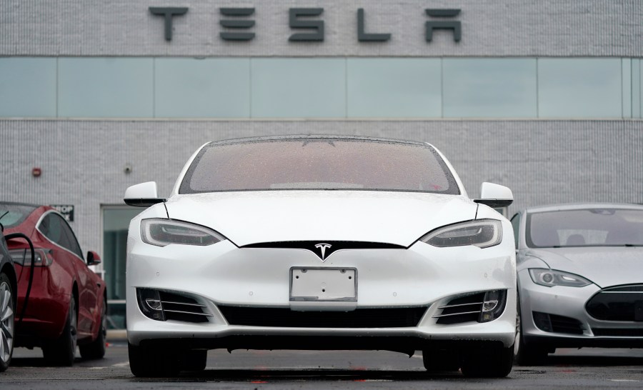 This Sunday, May 9, 2021 file photo shows vehicles at a Tesla location in Littleton, Colo. (AP Photo/David Zalubowski)