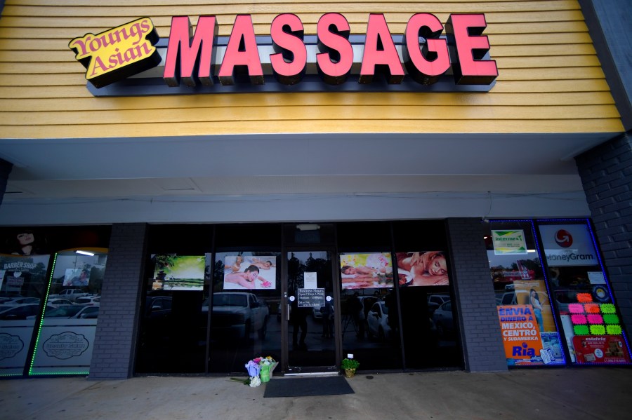 A make-shift memorial is seen on March 17, 2021, outside a business where a multiple fatal shooting occurred in Acworth, Ga. (Mike Stewart / Associated Press)