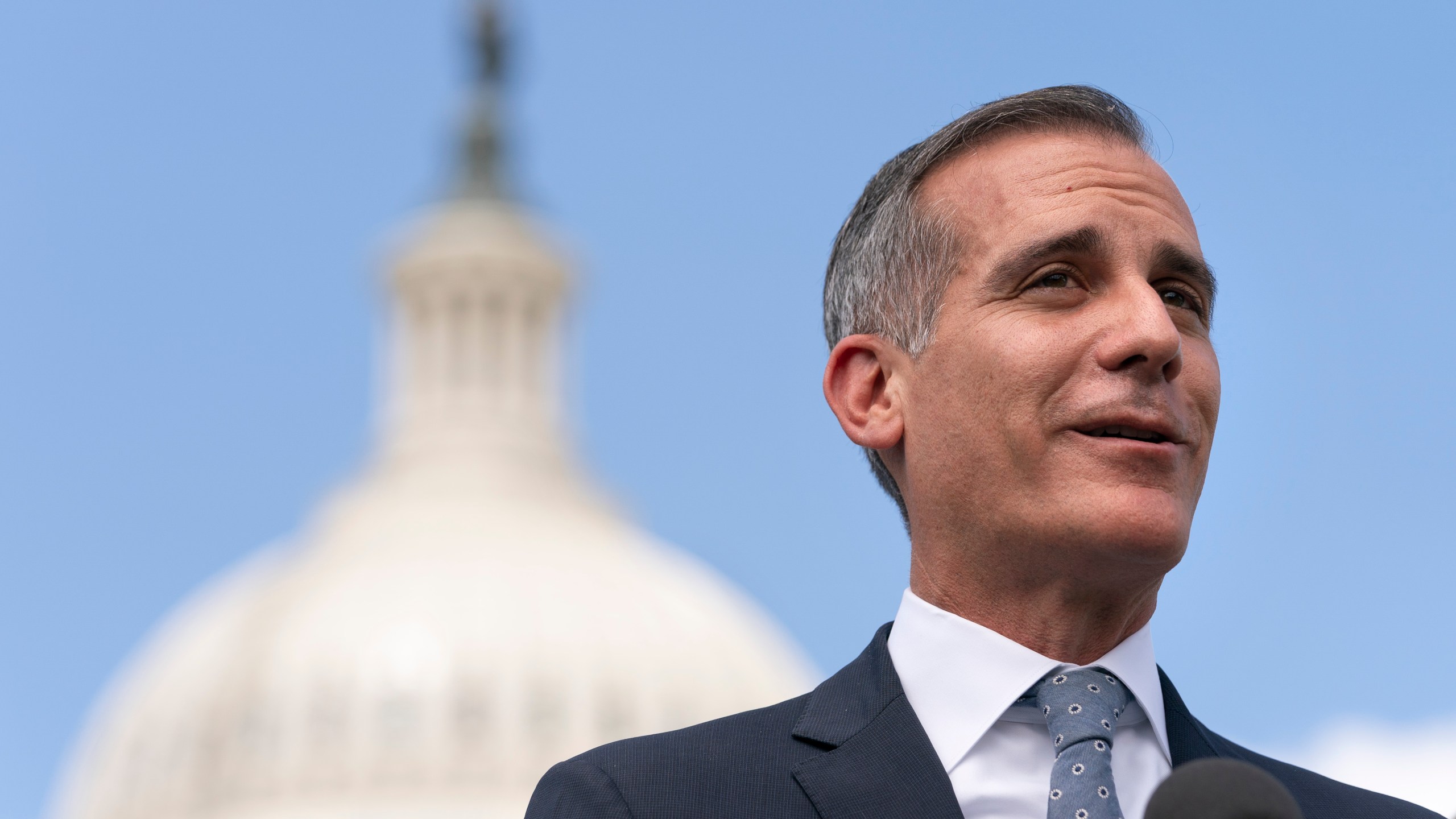 Los Angeles Mayor Eric Garcetti speaks during a news conference with House Transportation and Infrastructure Committee Chair Peter DeFazio on Capitol Hill in Washington on May 12, 2021. (Jacquelyn Martin / Associated Press)