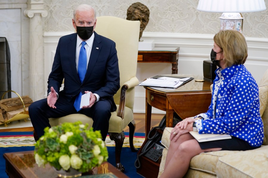 Sen. Shelley Moore Capito, R-W.Va., right, listens as President Joe Biden speaks during a meeting with Republican Senators in the Oval Office of the White House, Thursday, May 13, 2021, in Washington. (AP Photo/Evan Vucci)