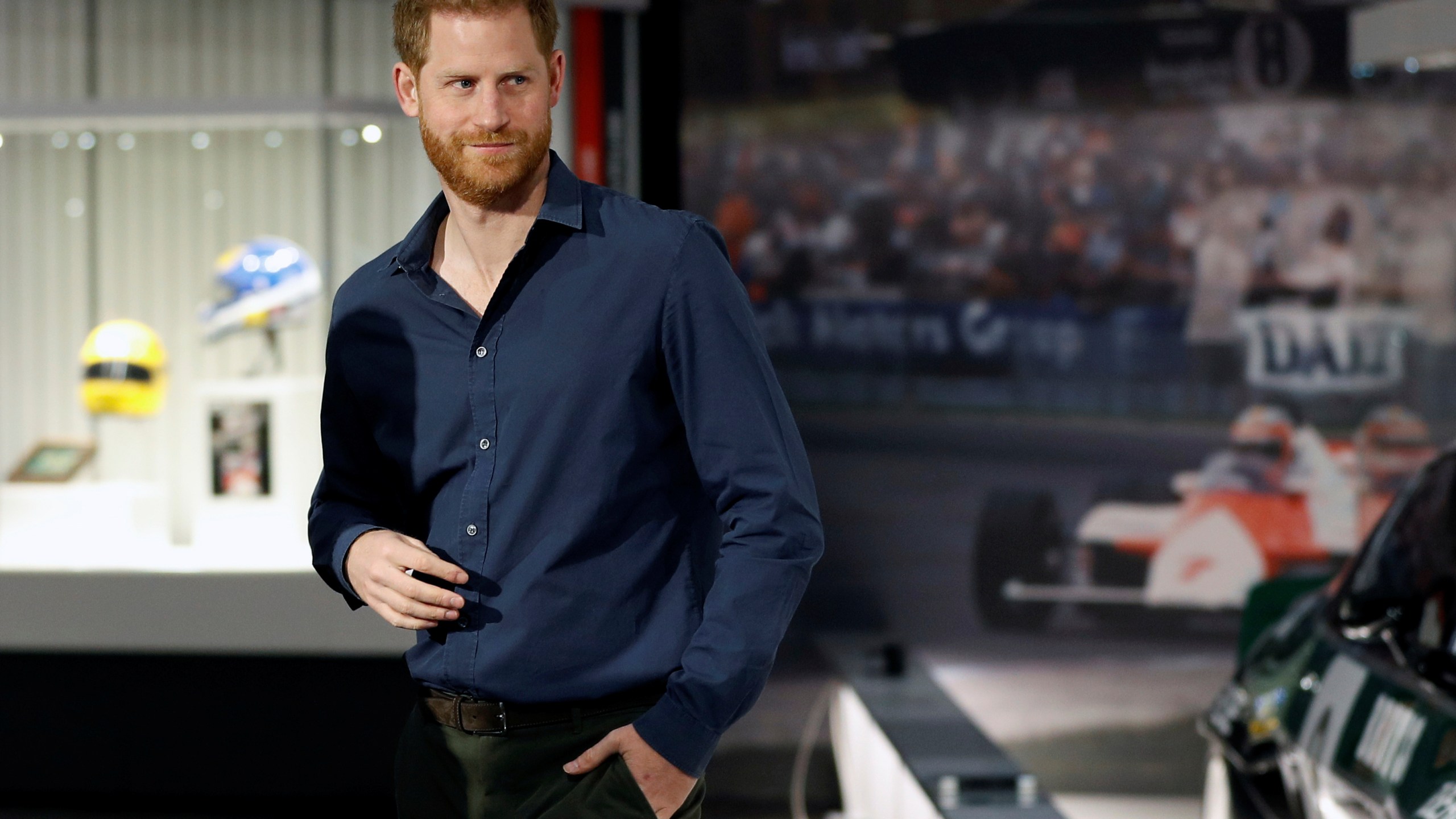 In this Friday March 6, 2020, file photo, Britain's Prince Harry visits the Silverstone Circuit, in Towcester, England. In an episode of the “Armchair Expert” podcast broadcast Thursday, May 13, 2021, Prince Harry compared his royal experience to being on “The Truman Show” and “living in a zoo.” (Peter Nicholls/Pool Photo via AP, File)