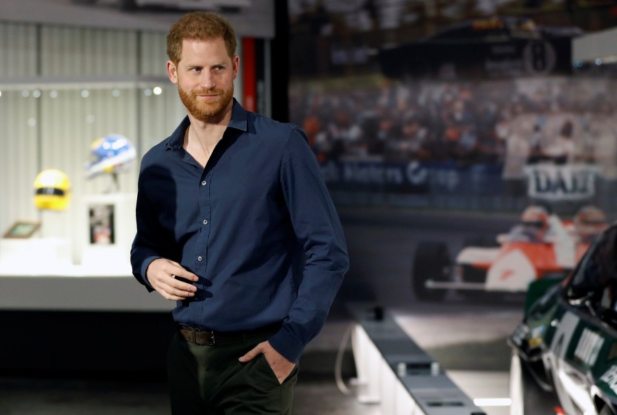 In this Friday March 6, 2020, file photo, Britain's Prince Harry visits the Silverstone Circuit, in Towcester, England. In an episode of the “Armchair Expert” podcast broadcast Thursday, May 13, 2021, Prince Harry compared his royal experience to being on “The Truman Show” and “living in a zoo.” (Peter Nicholls/Pool Photo via AP, File)