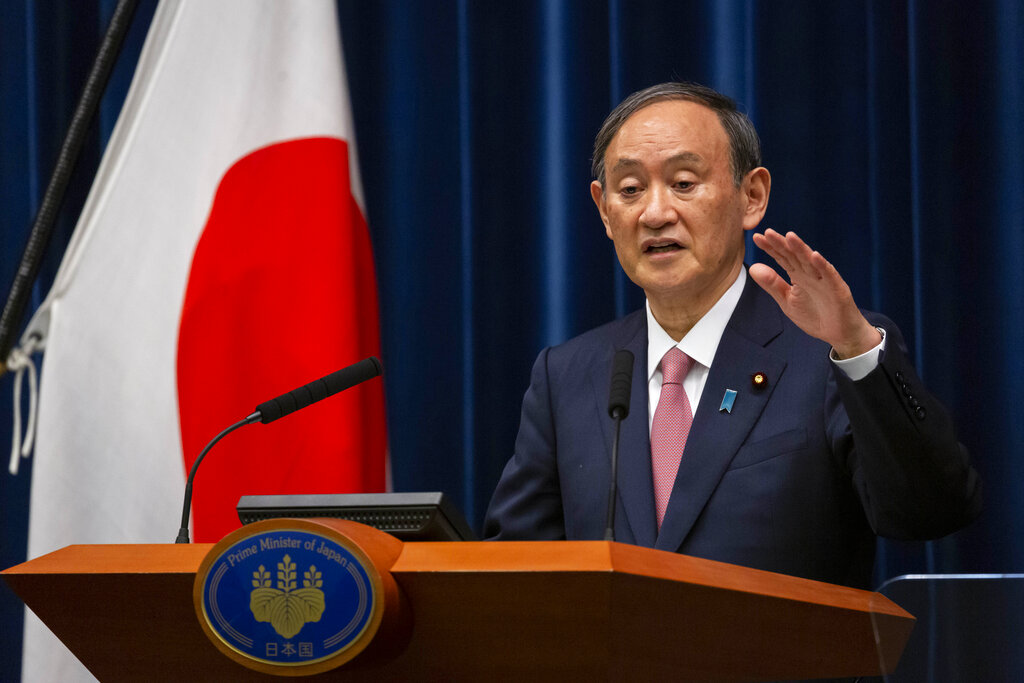 Japanese Prime Minister Yoshihide Suga speaks during a press conference at the prime minister's official residence on Friday, May 14, 2021, in Tokyo. (Yuichi Yamazaki/Pool Photo via AP)