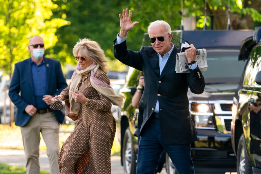 President Joe Biden with first lady Jill Biden waves as they walk on the Ellipse near the White House in Washington to board the Marine One, Saturday, May 15, 2021. (AP Photo/Manuel Balce Ceneta)