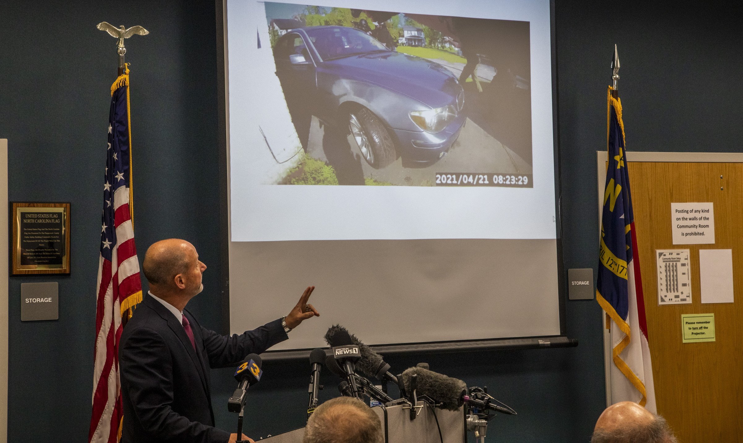 Pasquotank County District Attorney Andrew Womble shows still images from police body camera footage after announcing he will not charge deputies in the April 21 fatal shooting of Andrew Brown Jr. during a news conference Tuesday, May 18, 2021 at the Pasquotank County Public Safety building in Elizabeth City, N.C. Womble said he would not release bodycam video of the confrontation between Brown, a Black man, and the law enforcement officers. (Travis Long/The News & Observer via AP)