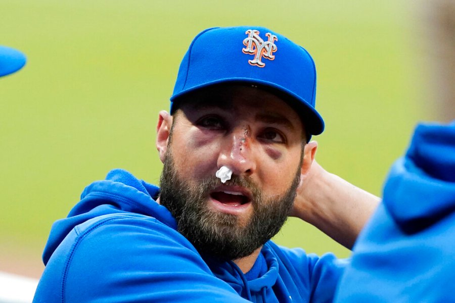 New York Mets' Kevin Pillar talks to teammates in the dugout before the team's baseball game against the Atlanta Braves on Tuesday, May 18, 2021, in Atlanta. (AP Photo/John Bazemore)