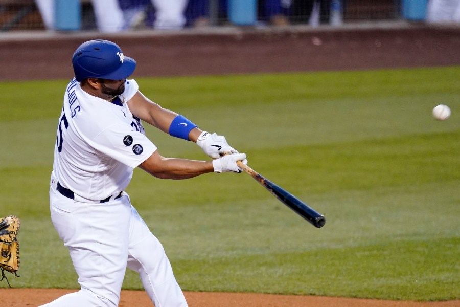 Los Angeles Dodgers' Albert Pujols hits a two-run home run during the second inning of a baseball game against the Arizona Diamondbacks on May 20, 2021, in Los Angeles. (Mark J. Terrill / Associated Press)