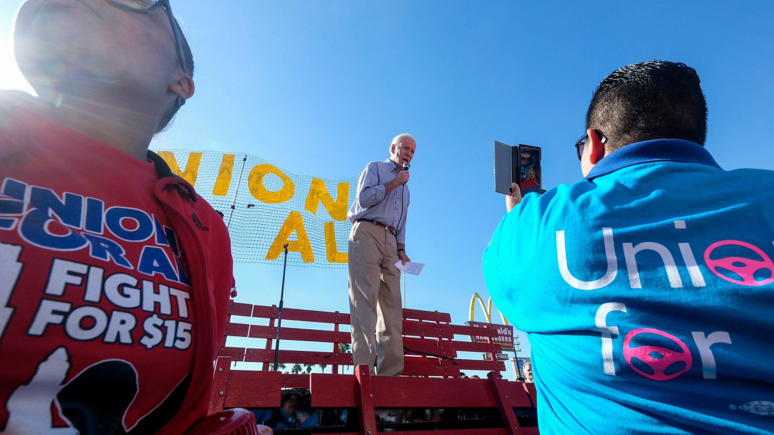 In this Dec. 19, 2019, file photo Democratic presidential candidate former Vice President Joe Biden, speaks at a rally in support of McDonald's cooks and cashiers who are demanding higher wages and union rights, outside a McDonald's restaurant in Los Angeles. (AP Photo/Ringo H.W. Chiu, File)