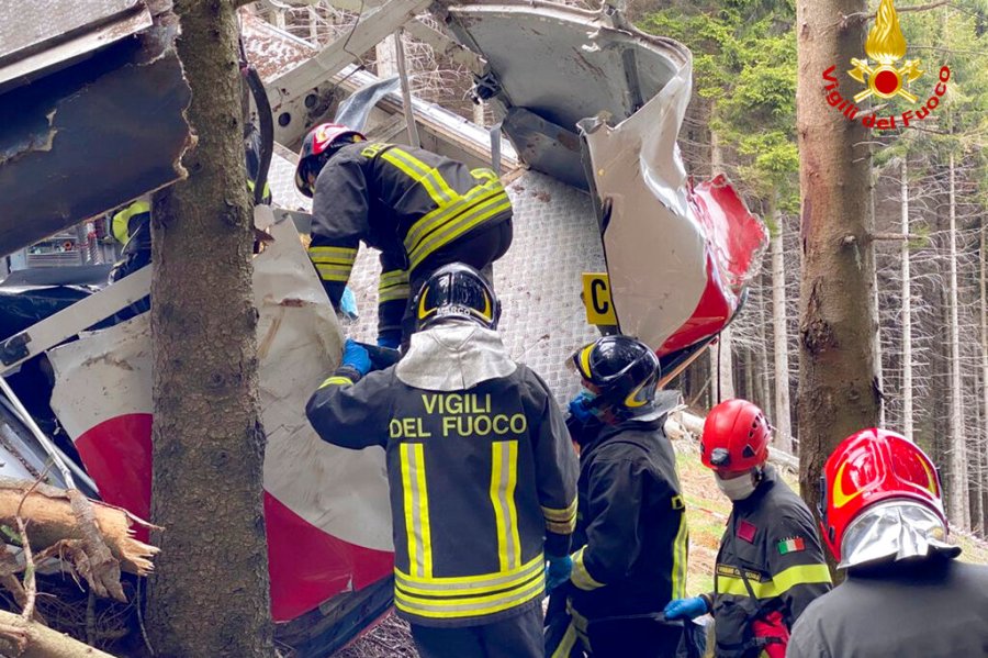 Rescuers work by the wreckage of a cable car after it collapsed near the summit of the Stresa-Mottarone line in the Piedmont region, northern Italy, Sunday, May 23, 2021. (Vigili del Fuoco Firefighters via AP)