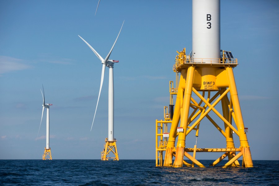 In this Aug. 15, 2016 file photo, three of Deepwater Wind's five turbines stand in the water off Block Island, R.I, the nation's first offshore wind farm. California and the federal government have agreed to open up areas off the central and northern coasts to massive wind farms. The pact announced Tuesday, May 25, 2021, that would float hundreds of turbines off the coast of Morro Bay and Humboldt Bay was touted as a breakthrough to eventually power 1.6 million homes. (AP Photo/Michael Dwyer, File)