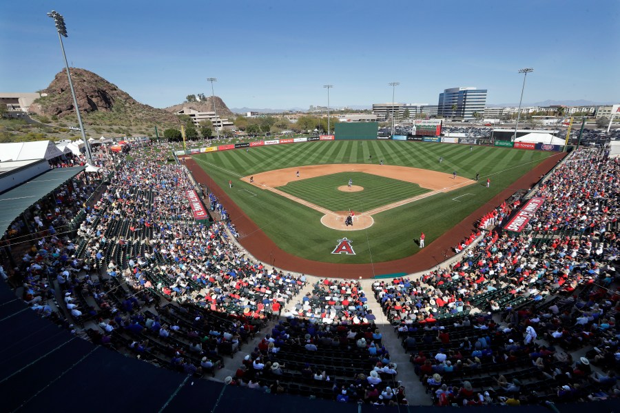 In this March 5, 2019, file photo, fans fill most of the seats at Tempe Diablo Stadium, the Los Angeles Angels' spring stadium ballpark, during the team's spring training baseball game against the Chicago Cubs in Tempe, Ariz. (AP Photo/Elaine Thompson, File)