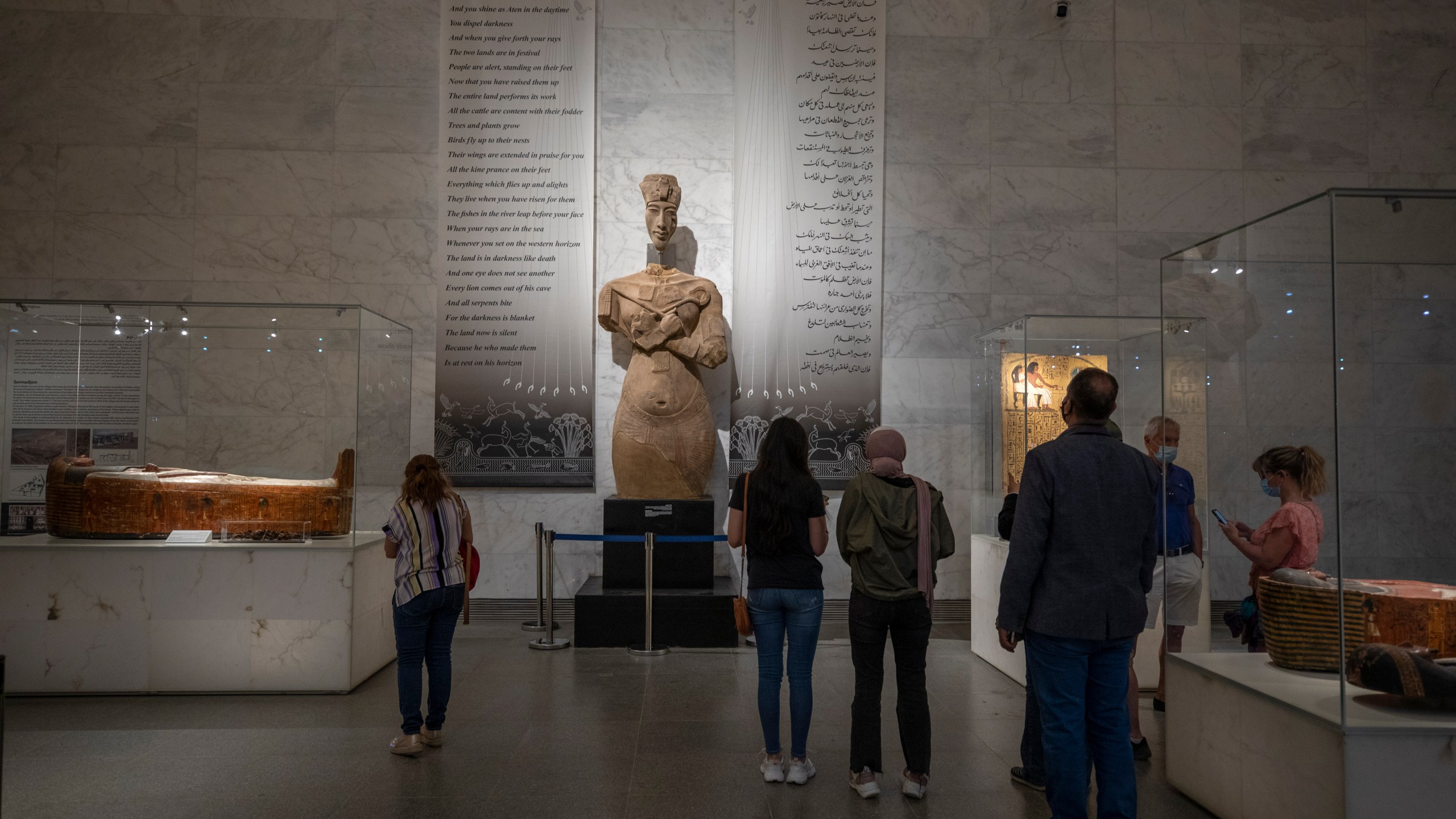 In this April 24, 2021 file photo, people visit the new National Museum of Egyptian Civilization in Old Cairo. As some European countries re-open to international tourists, Egypt has already been trying for months to attract them to its archaeological sites and museums. Officials are betting that the new ancient discoveries will set it apart on the mid- and post-pandemic tourism market (AP Photo/Nariman El-Mofty, File)