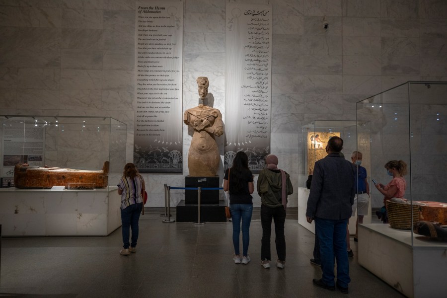 In this April 24, 2021 file photo, people visit the new National Museum of Egyptian Civilization in Old Cairo. As some European countries re-open to international tourists, Egypt has already been trying for months to attract them to its archaeological sites and museums. Officials are betting that the new ancient discoveries will set it apart on the mid- and post-pandemic tourism market (AP Photo/Nariman El-Mofty, File)