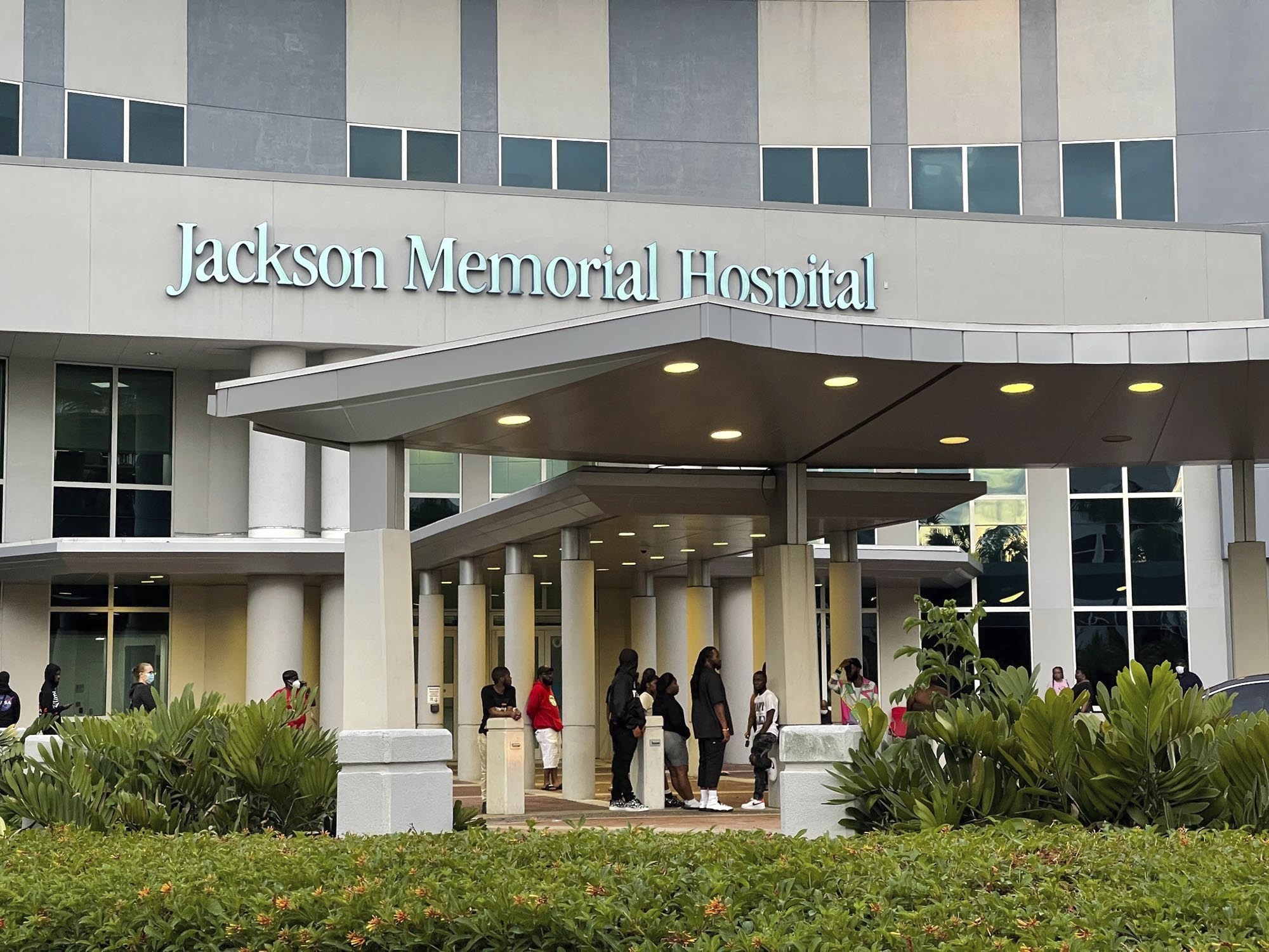 Family and friends of victims of a shooting outside a banquet hall wait outside the Ryder Trauma Center at Jackson Memorial Hospital in Miami, Sunday morning May 30, 2021. The gunfire erupted early Sunday at the El Mula Banquet Hall in northwest Miami-Dade County, near Hialeah, police told news outlets. (Devoun Cetourte/Miami Herald via AP)