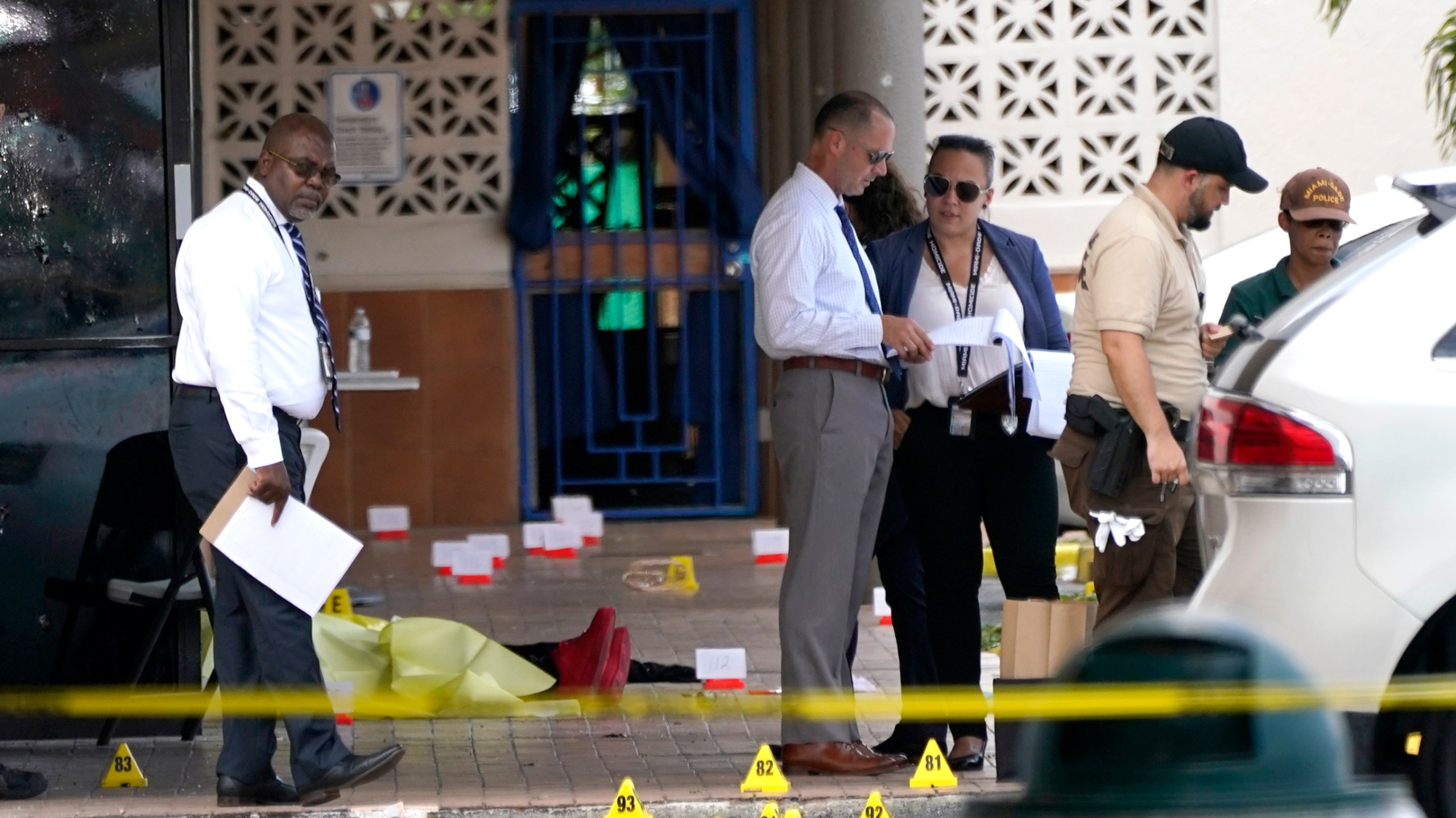 Law enforcement officials work the scene of a shooting outside a banquet hall near Hialeah, Fla. on May 30, 2021. (Lynne Sladky/Associated Press)