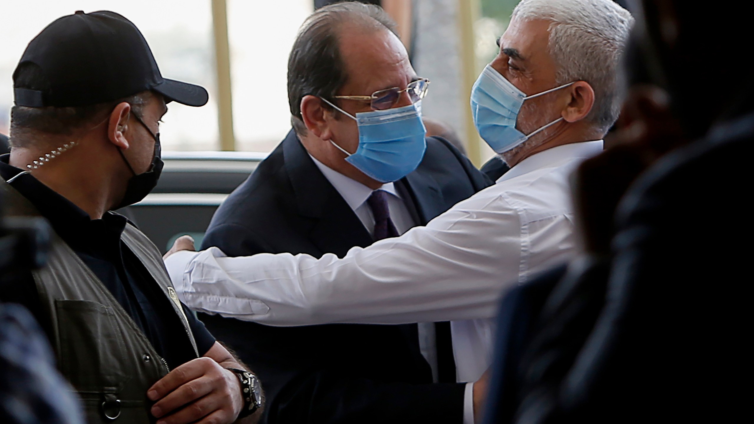 Yehiyeh Sinwar, right, the top Hamas leader in Gaza, hugs head of the Egyptian General Intelligence Abbas Kamel as they meet in Gaza Monday, May 31, 2021. (Mohammed Salem/Pool Photo via AP)