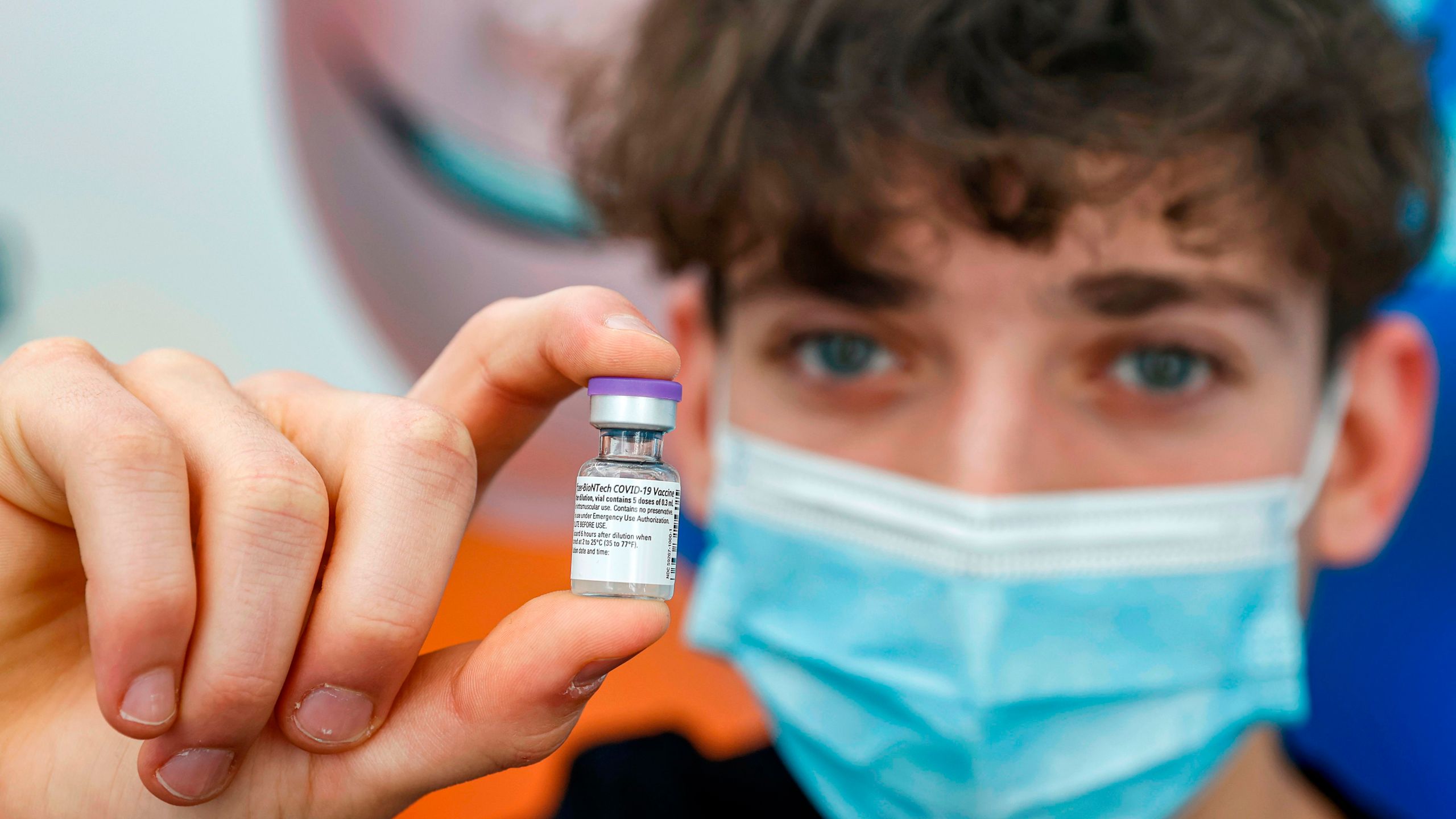 Jonathan, a 16-year-old teenager, receives a dose of the Pfizer-BioNtech COVID-19 coronavirus vaccine at Clalit Health Services, in Israel's Mediterranean coastal city of Tel Aviv on January 23, 2021. (JACK GUEZ/AFP via Getty Images)