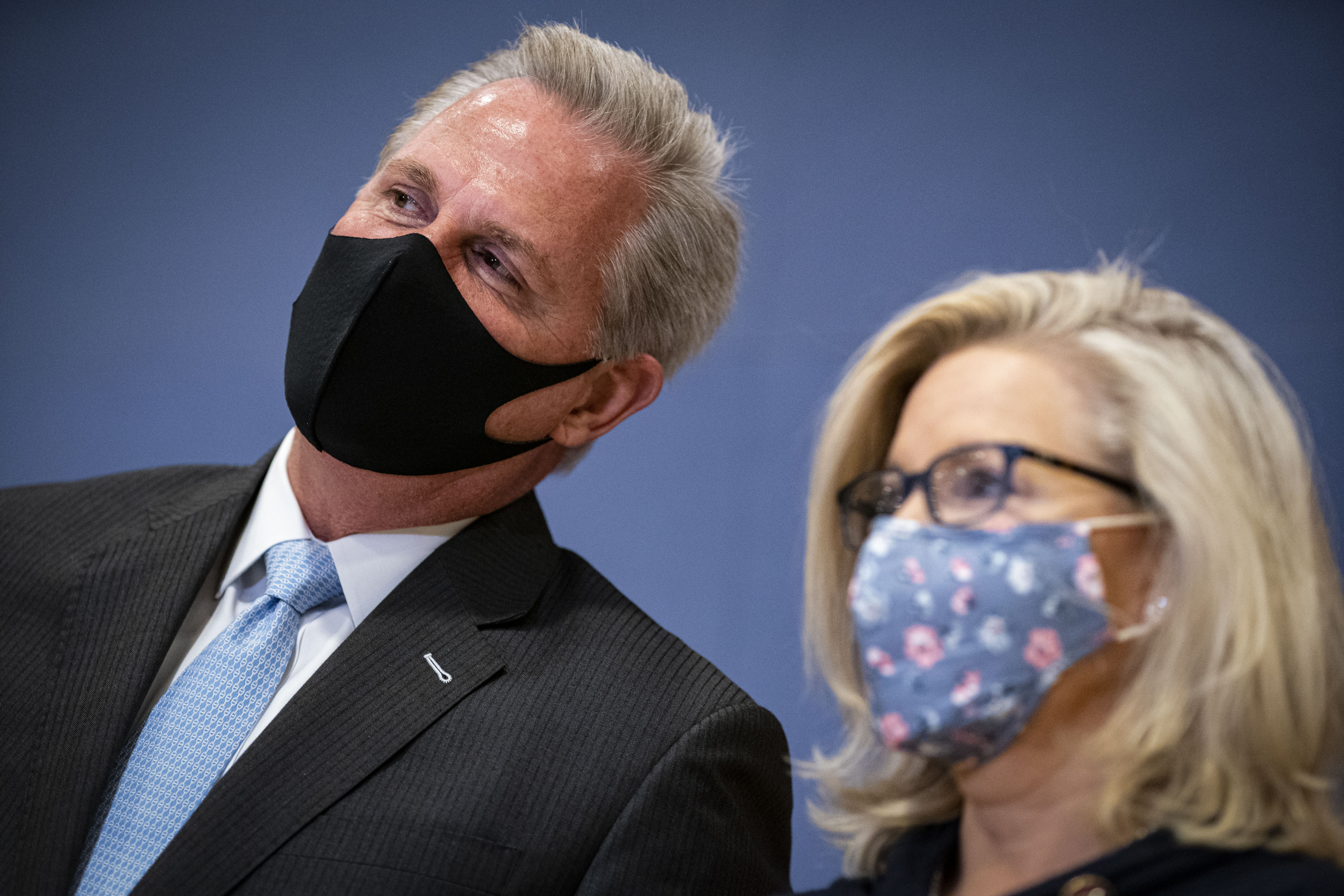 House Minority Leader Kevin McCarthy (R-CA) whispers to Rep. Liz Cheney (R-WY) during a House Republican Leadership news conference in the U.S. Capitol on February 24, 2021. (Al Drago/Getty Images)