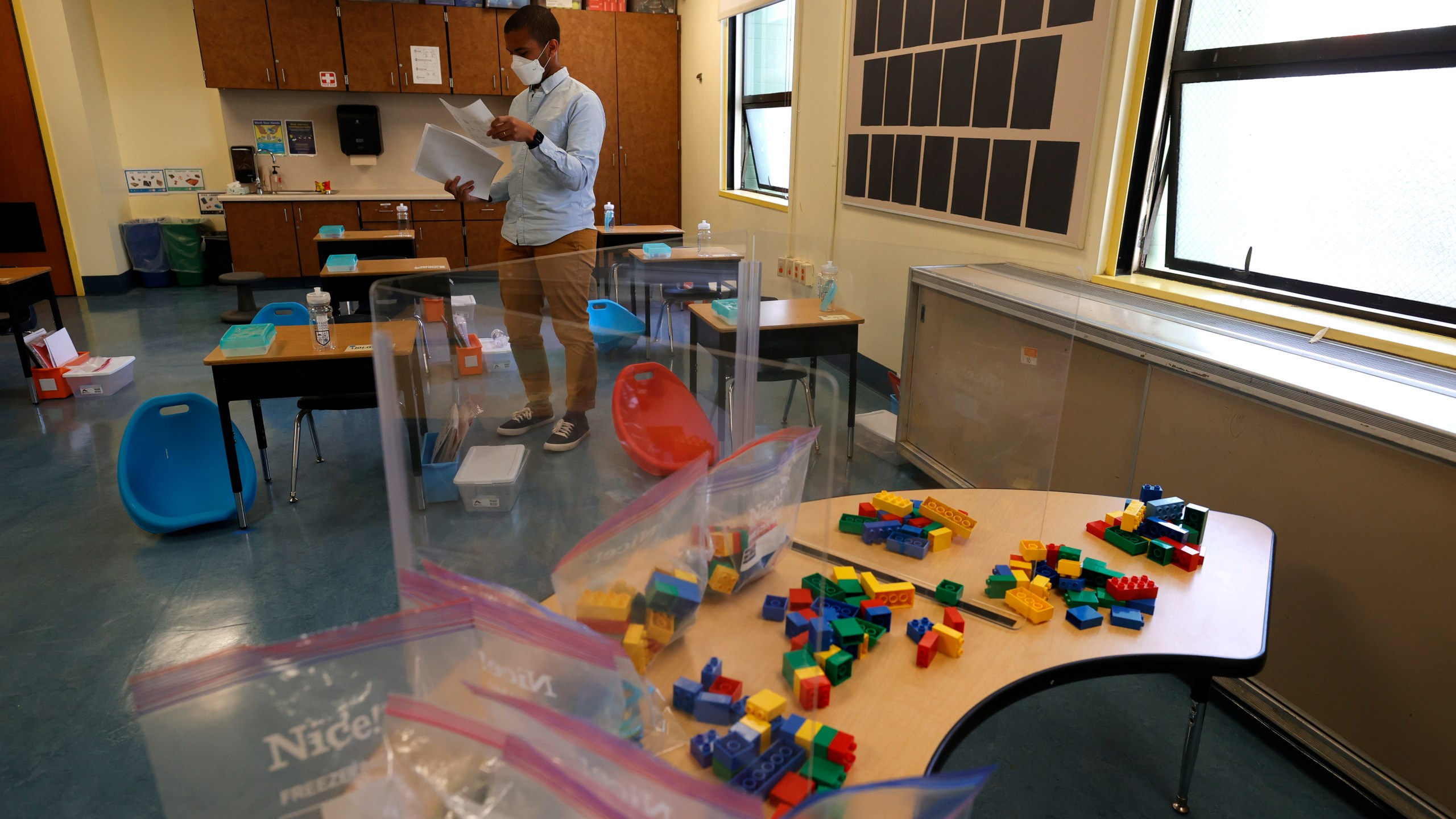 Bryant Elementary School kindergarten teacher Chris Johnson sets up his classroom on April 09, 2021 in San Francisco, California. (Justin Sullivan/Getty Images)