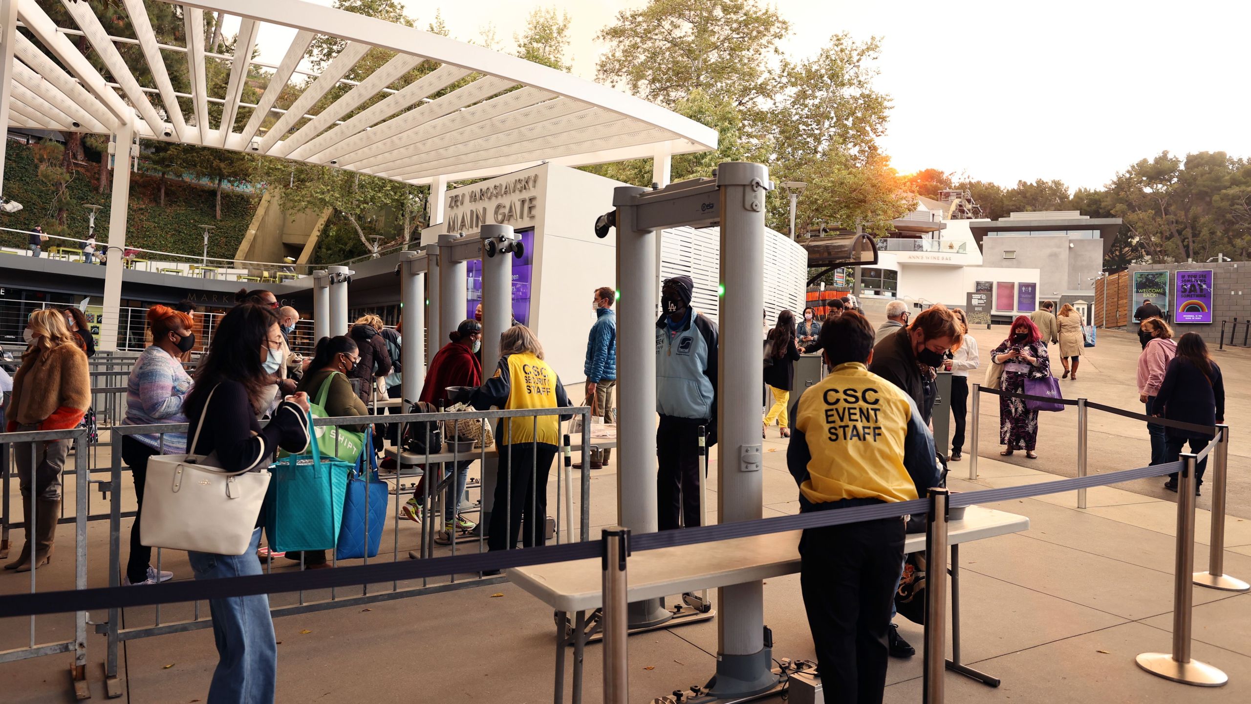 Guests walk through metal detectors and have their bags checked during the reopening of The Hollywood Bowl with a concert for healthcare workers, first responders and essential workers at Hollywood Bowl on May 15, 2021 in Los Angeles. (Amy Sussman/Getty Images)