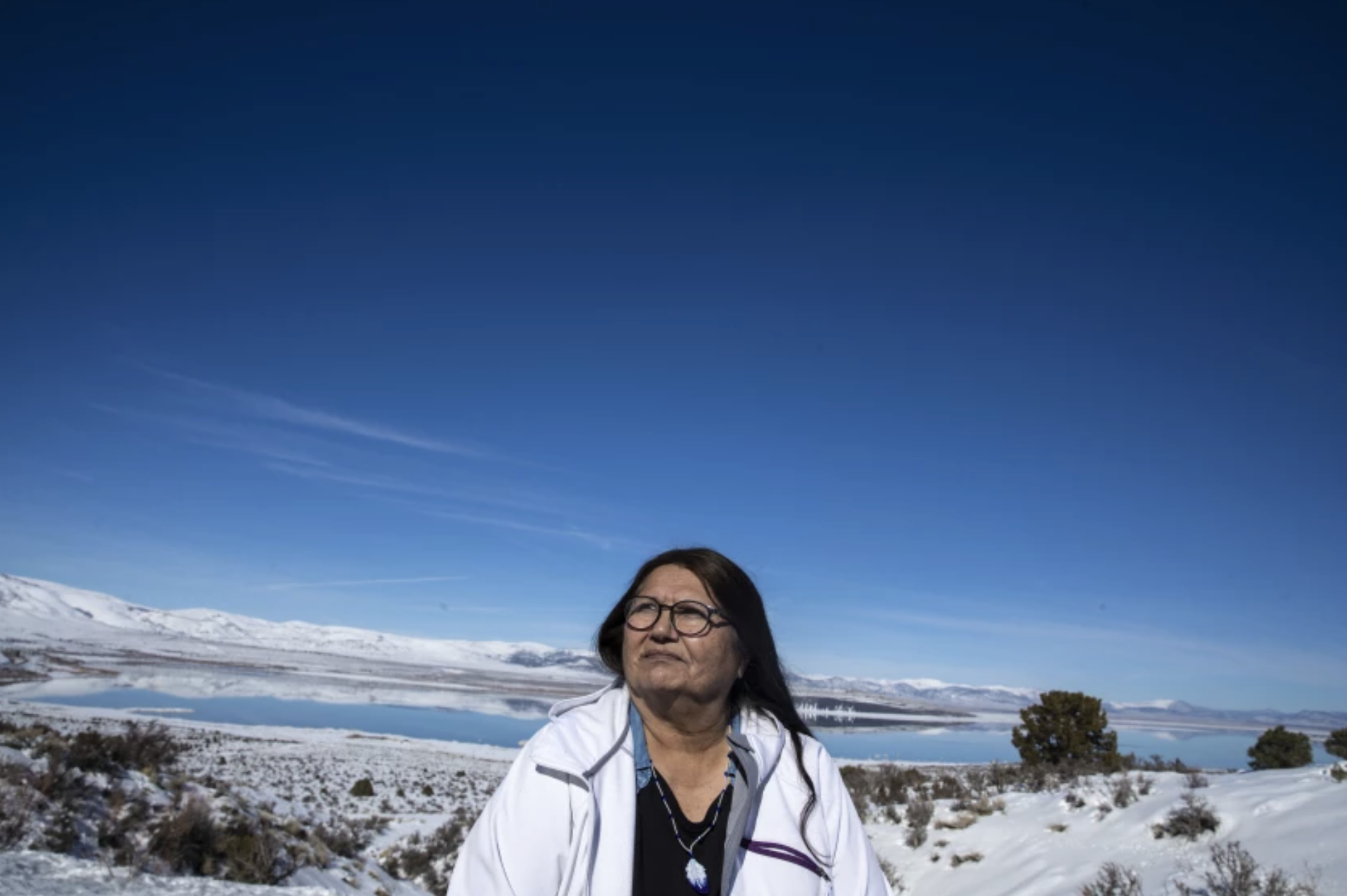 Charlotte Lange, 67, chairwoman of the Mono Lake Kutzadika Paiute tribe, sits for a portrait in February on a bluff in Lee Vining overlooking the lake. The tribe is among roughly two dozen unrecognized and landless tribes in California.(Brian van der Brug / Los Angeles Times)