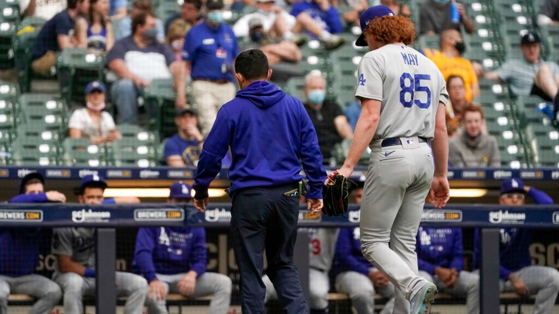 Los Angeles Dodgers starting pitcher Dustin May leaves the game after being injured during the second inning of a baseball game against the Milwaukee Brewers Saturday, May 1, 2021, in Milwaukee. (AP Photo/Morry Gash)