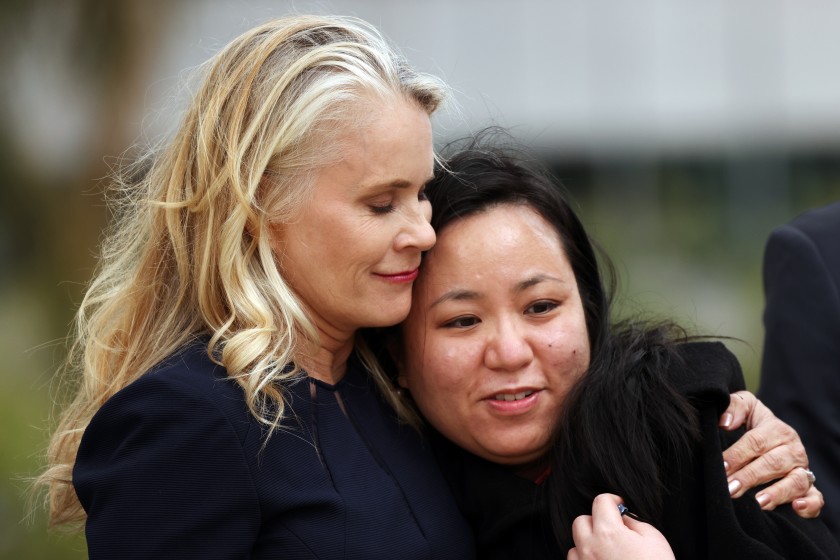 Audry Nafziger, left, hugs Lucy Chi after attorneys announced a landmark $852-million settlement with former patients of Dr. George Tyndall.(Dania Maxwell/Los Angeles Times)