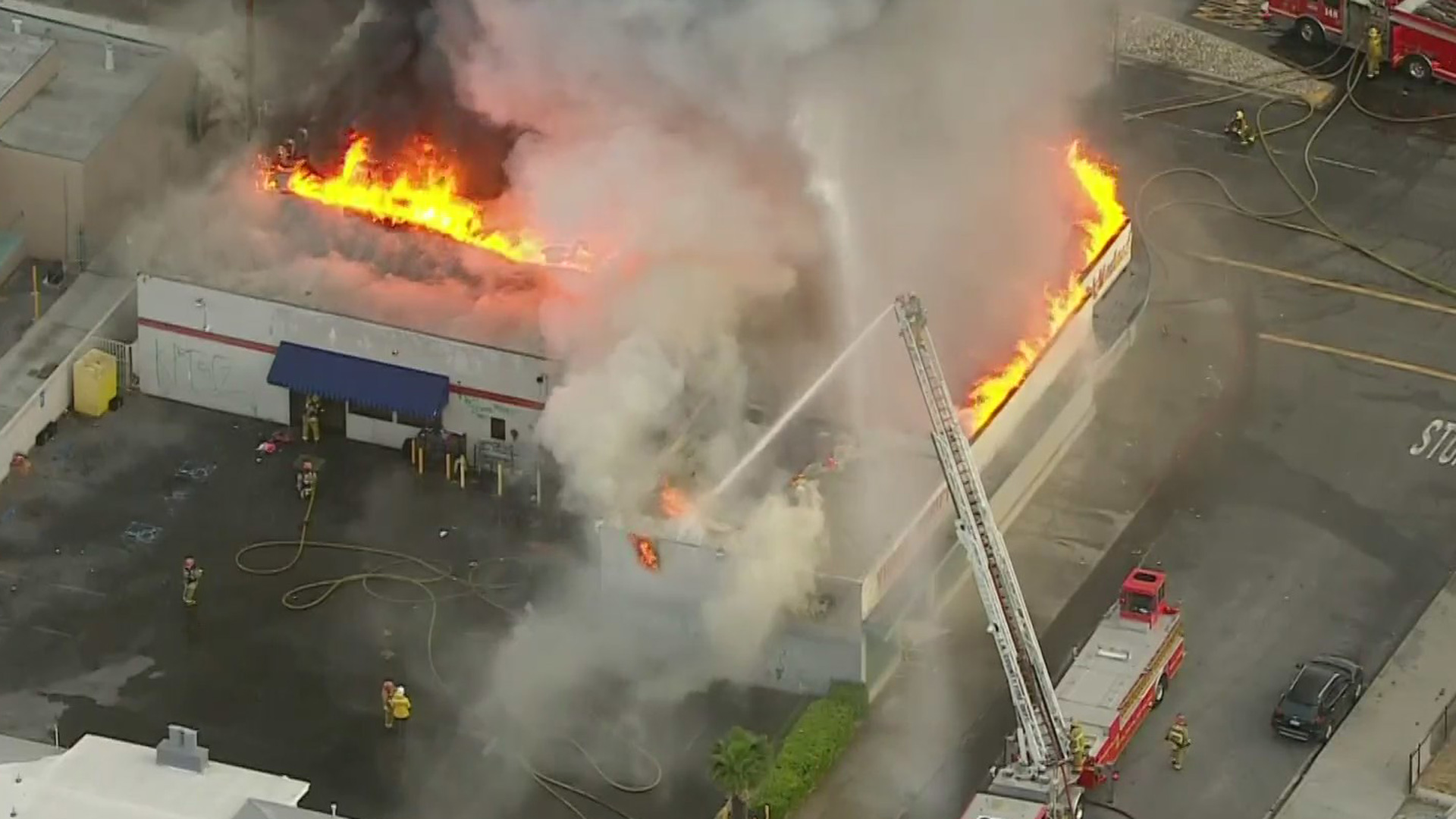 Firefighters battled a blaze at a Compton liquor store on May 26, 2021. (KTLA)