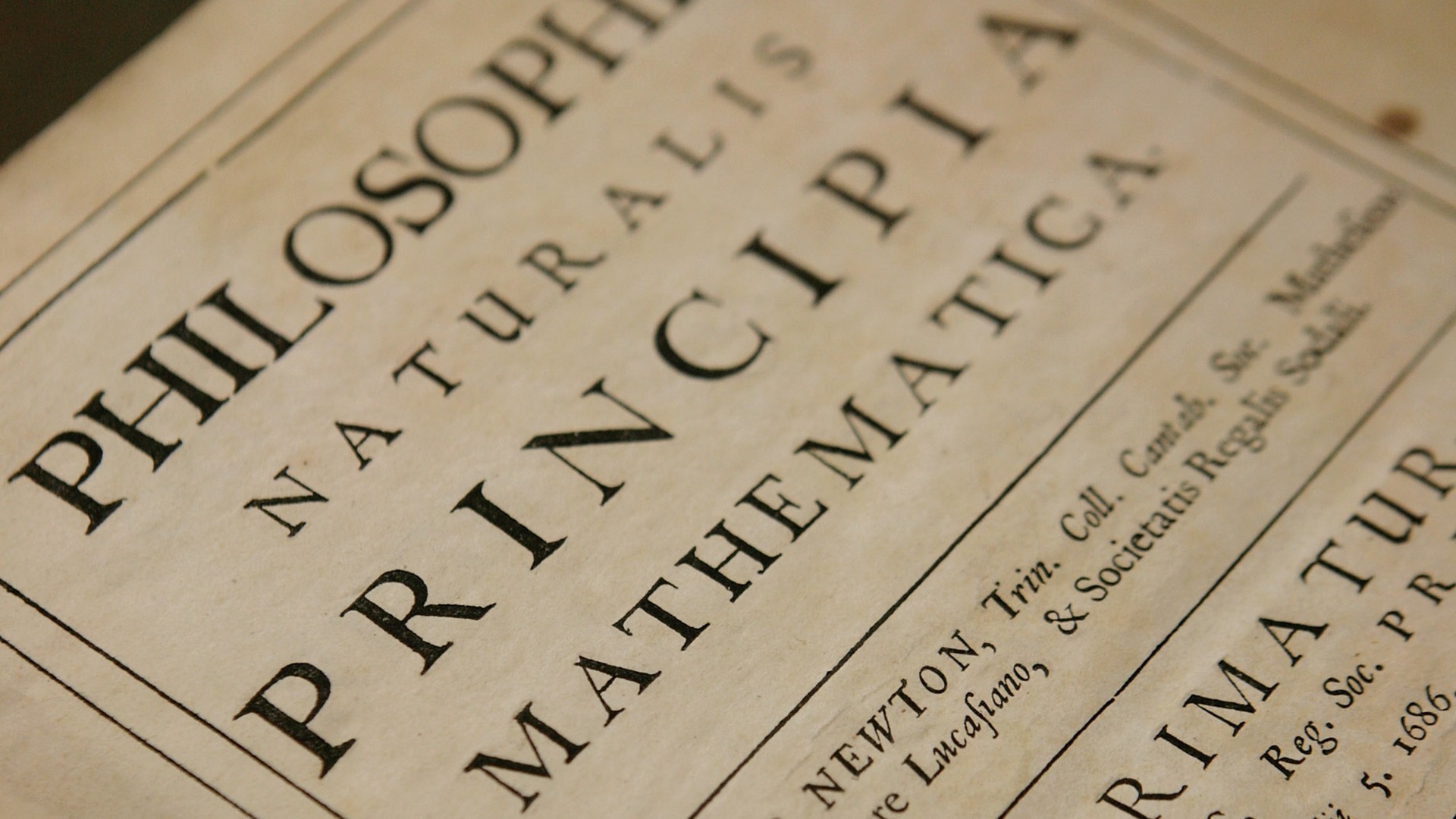 In this photo illustration, Head of Library and Archives Rupert Williams (unseen) holds a copy Philosphiae Naturalis Principia Mathematica (one of the most important scientific works ever written) by Sir Isaac Newton at the Science Museum Library and Archives on March 11, 2008 in Swindon, England. (Daniel Berehulak/Getty Images)