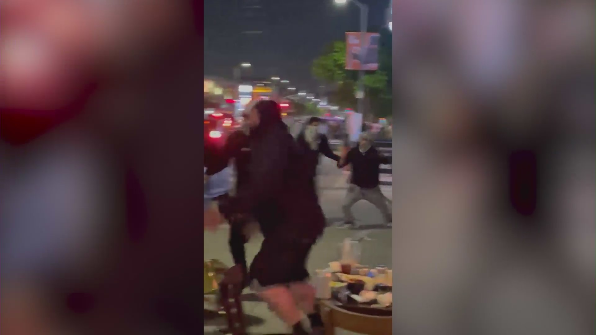 A fight outside a Beverly Grove restaurant was captured on cellphone video and provided to KTLA by an anonymous viewer on May 18, 2021.