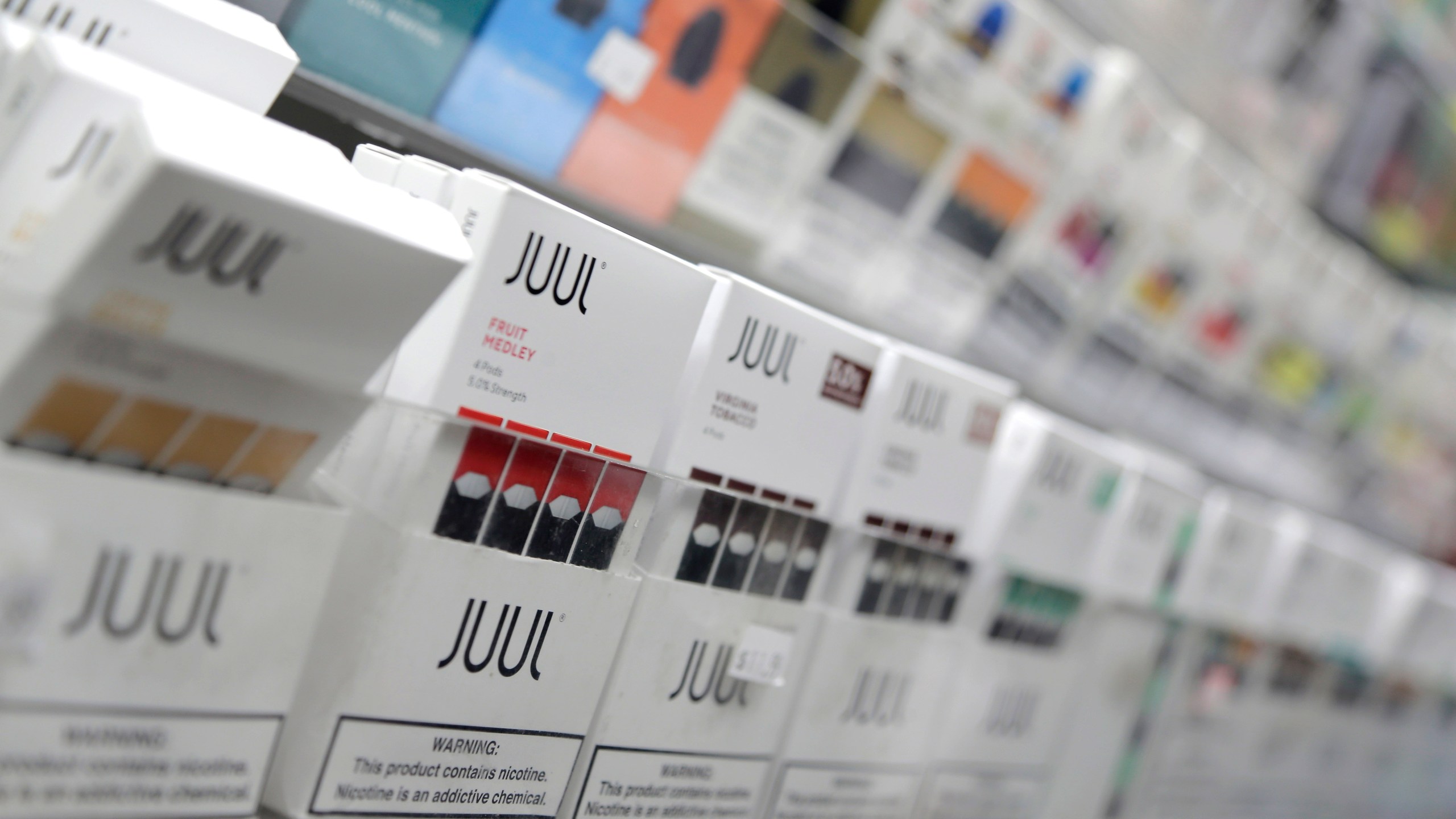 In this Dec. 20, 2018, file photo, Juul products are displayed at a smoke shop in New York. (AP Photo/Seth Wenig, File)