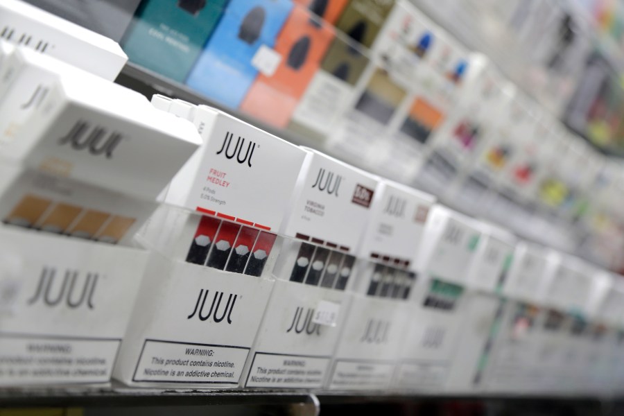 In this Dec. 20, 2018, file photo, Juul products are displayed at a smoke shop in New York. (AP Photo/Seth Wenig, File)