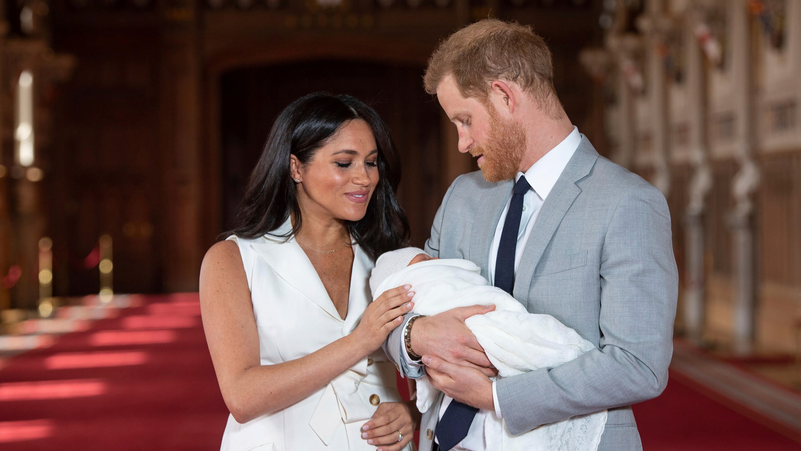 In this Wednesday May 8, 2019 file photo Britain's Prince Harry and Meghan, Duchess of Sussex, pose during a photocall with their newborn son Archie, in St George's Hall at Windsor Castle, Windsor, south England. (Dominic Lipinski/Pool via AP, file)