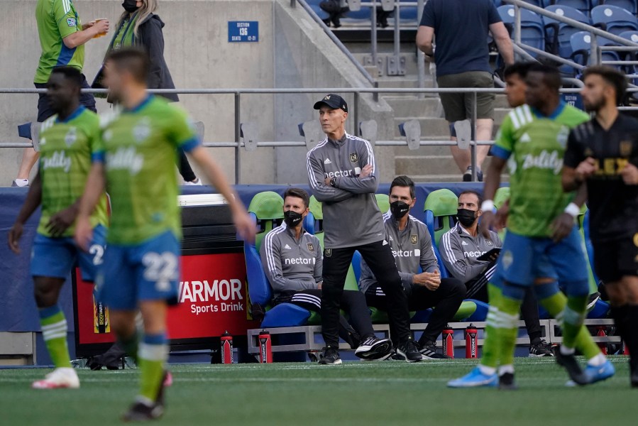 Los Angeles FC head coach Bob Bradley watches from the sideline during the second half of an MLS soccer match against the Seattle Sounders May 16, 2021, in Seattle. (Ted S. Warren/Associated Press)