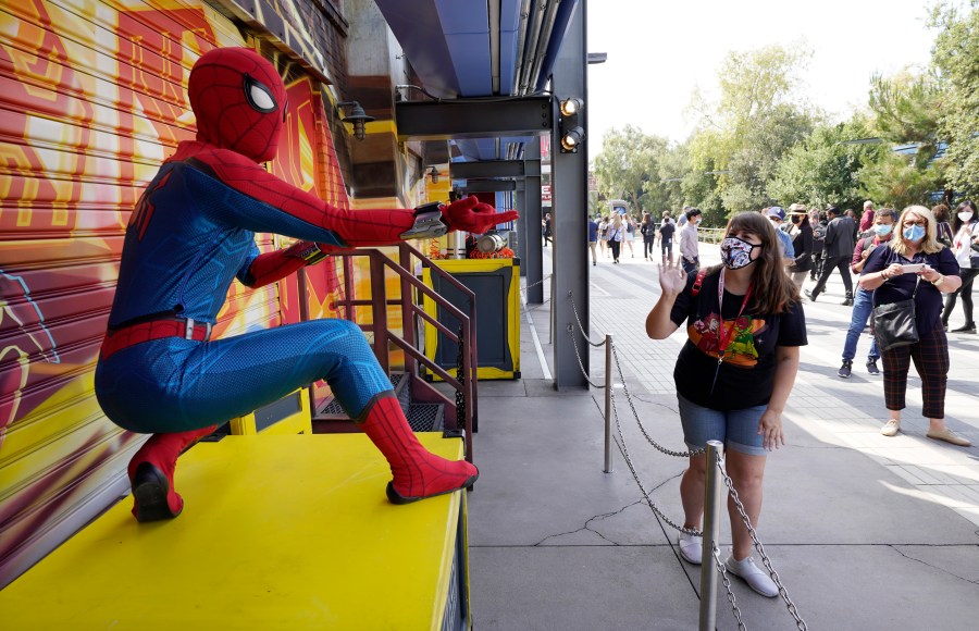 A Spider-Man character poses for guests following "The Amazing Spider-Man!" show at the Avengers Campus media preview at Disney's California Adventure Park on June 2, 2021, in Anaheim, Calif. (AP Photo/Chris Pizzello)