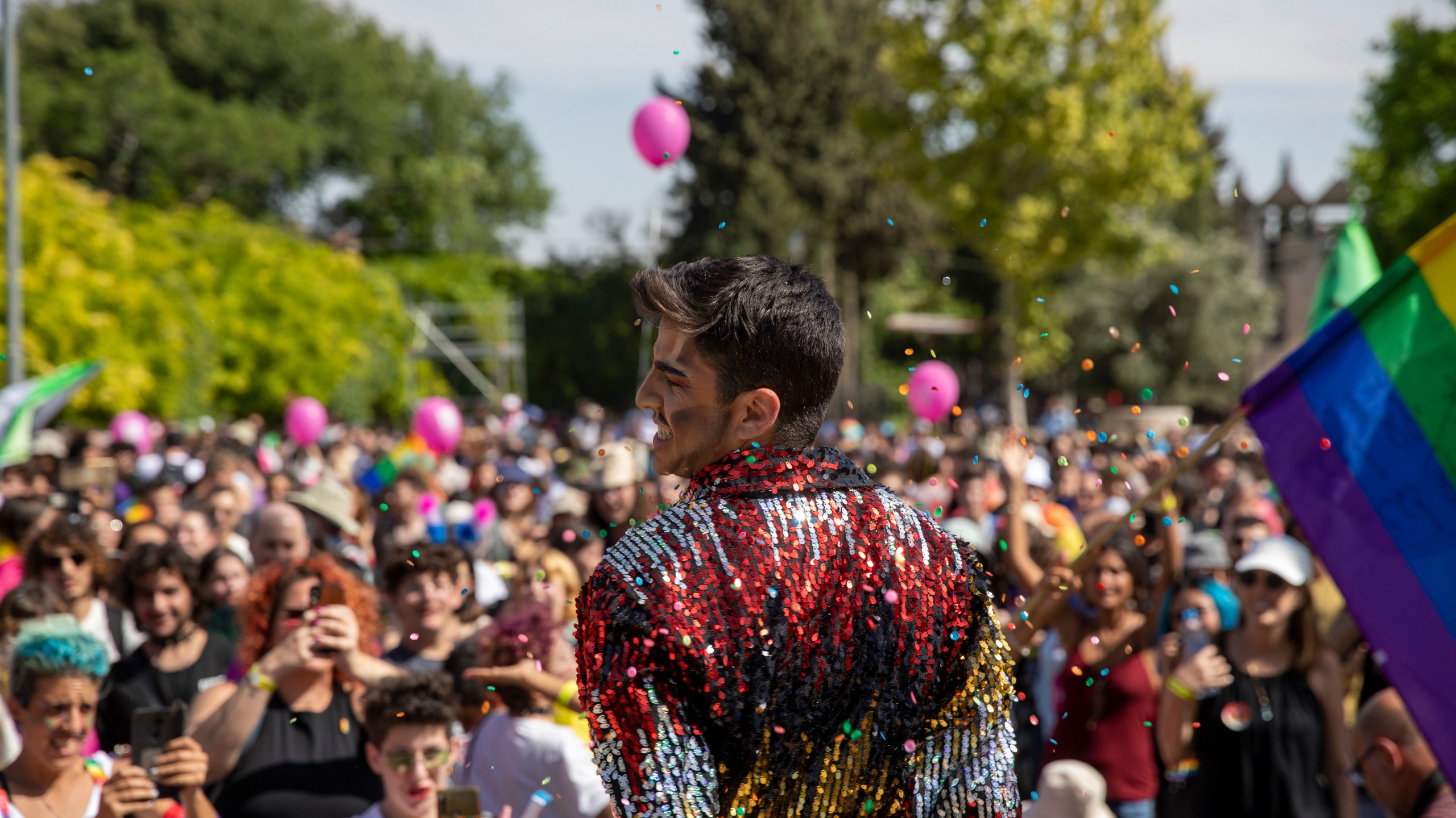 Participants dance in the annual Gay Pride parade in Jerusalem, Thursday, June 3, 2021. Thousands of people marched through the streets of Jerusalem on Thursday in the city's annual gay pride parade. (AP Photo/Ariel Schalit)