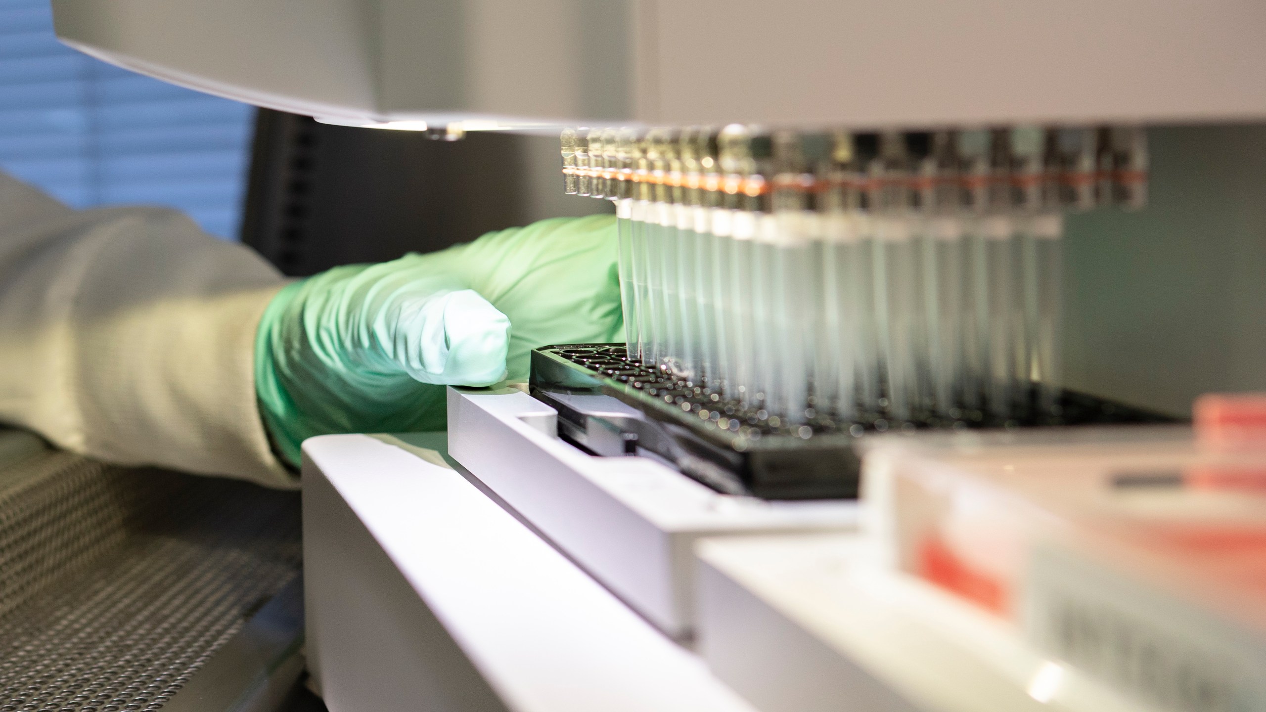 In this 2019 photo provided by Biogen, a researcher works on the development of the medication aducanumab in Cambridge, Mass. On Monday, June 7, 2021, the Food and Drug Administration approved aducanumab, the first new drug for Alzheimer’s disease in nearly 20 years, disregarding warnings from independent advisers that the much-debated treatment hasn’t been shown to help slow the brain-destroying disease. (Biogen via AP)