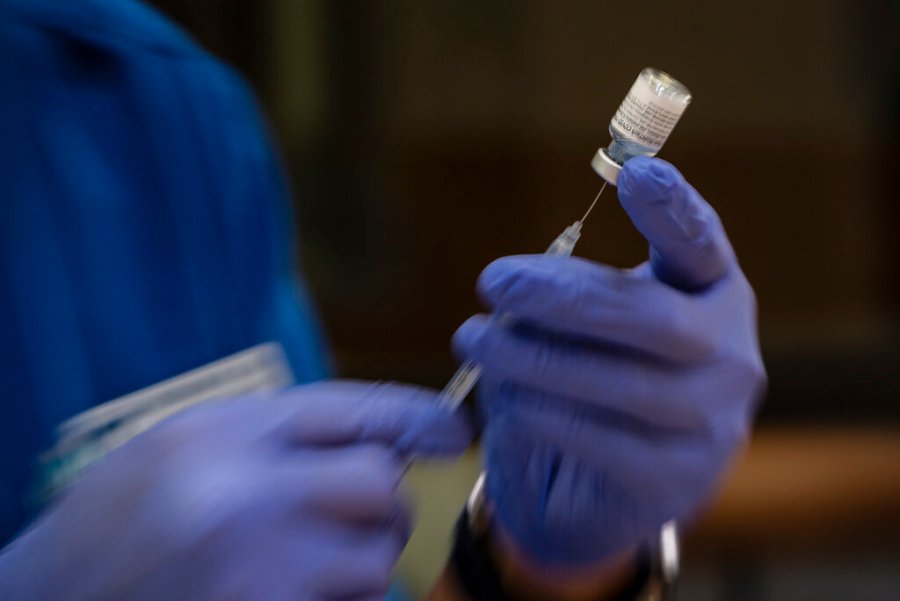 Odessa College nursing student Moon Suk Kim prepares doses of the Pfizer COVID-19 vaccine for use in a vaccination clinic hosted by Odessa College Thursday, June 3, 2021 in Odessa, Texas. (Eli Hartman/Odessa American via AP)