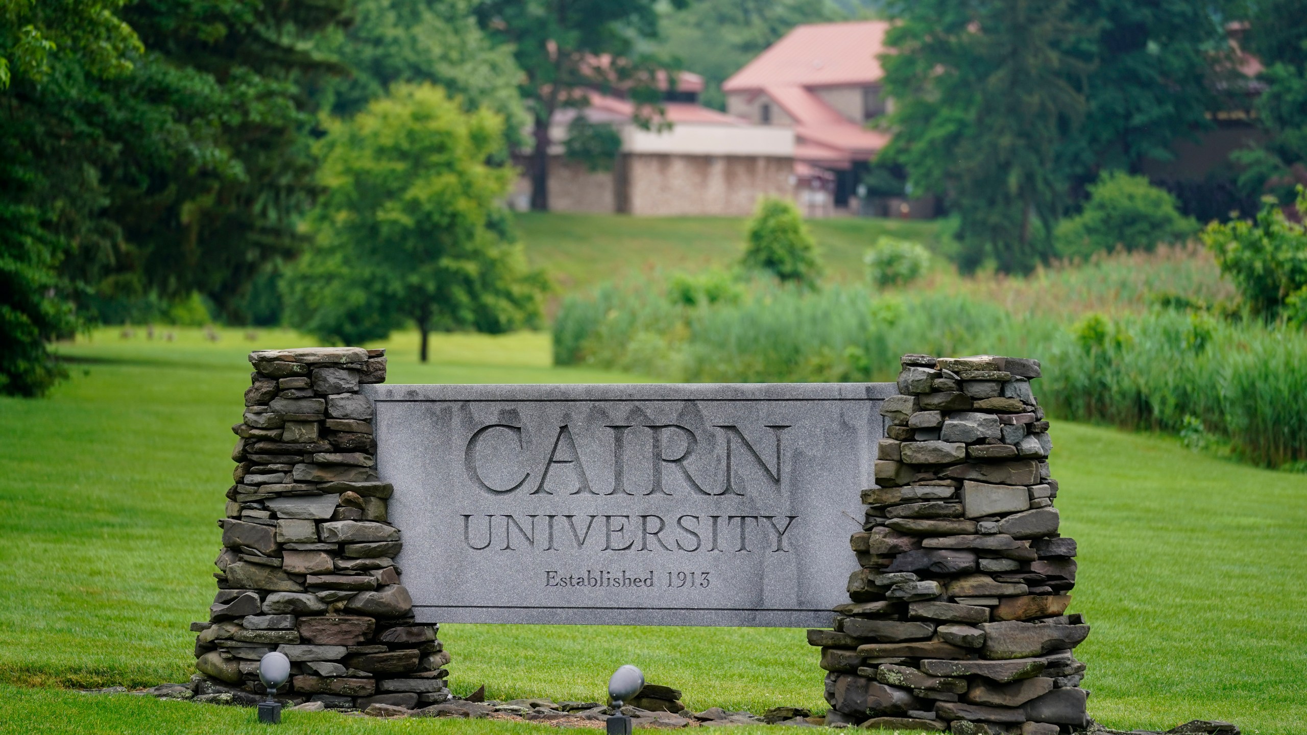 A sign for Cairn University is displayed at the campus in Langhorne, Pa., Friday, June 4, 2021. The Christian university outside of Philadelphia has shuttered its highly-regarded social work degree program partly because university officials said the national accrediting agency was attempting to impose values regarding sexuality and gender that did not align with the university's religious mission. (AP Photo/Matt Rourke)