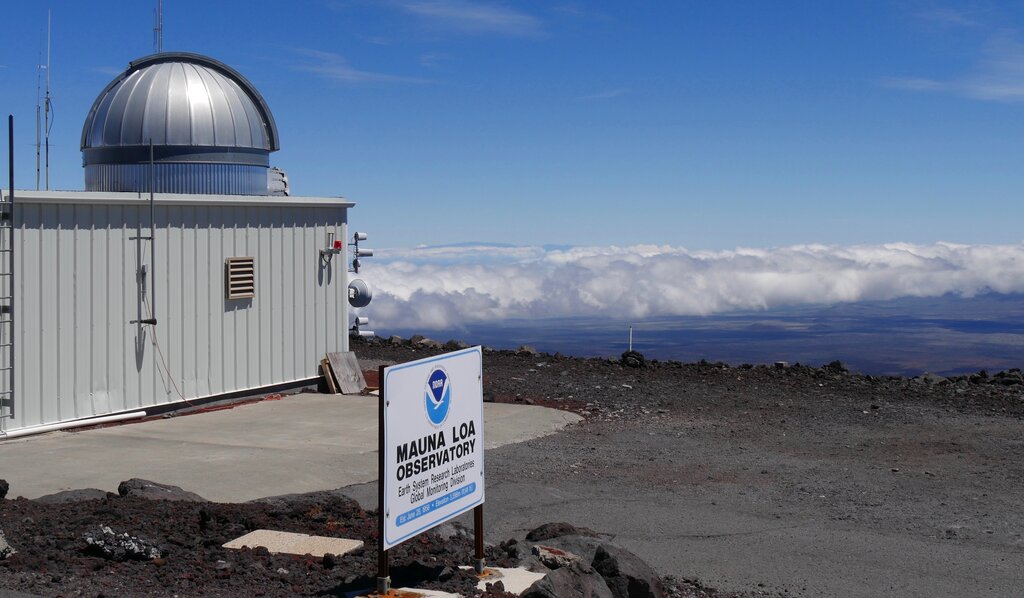 This 2019 photo provided by NOAA shows the Mauna Loa Atmospheric Baseline Observatory, high atop Hawaii's largest mountain in order to sample well-mixed background air free of local pollution. (Susan Cobb/NOAA Global Monitoring Laboratory via AP)