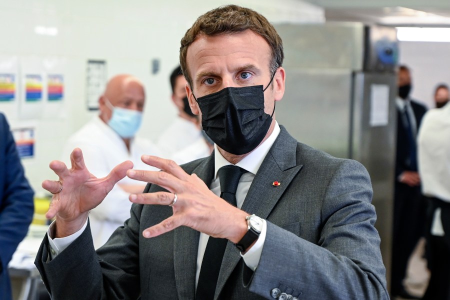 French President Emmanuel Macron talks to journalists Tuesday June 8, 2021 at the Hospitality school in Tain-l'Hermitage, southeastern France. French President Emmanuel Macron has been slapped in the face by a man during a visit in a small town of southeastern France, Macron's office confirmed. (Philippe Desmazes, Pool via AP)