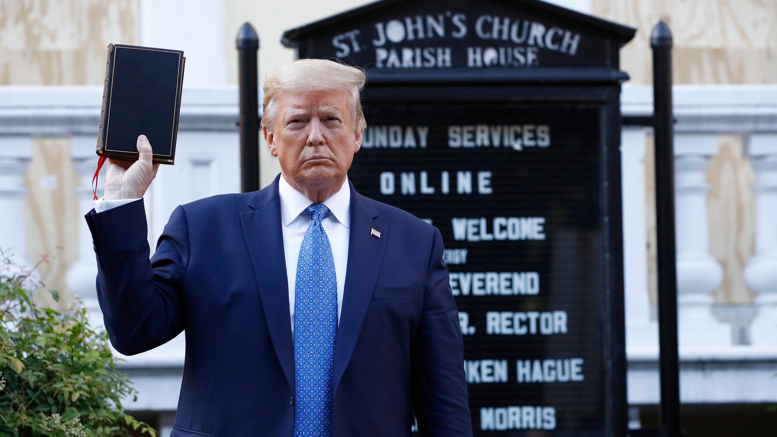 In this June 1, 2020, file photo President Donald Trump holds a Bible as he visits outside St. John's Church across Lafayette Park from the White House in Washington. An internal investigation has determined that the decision to clear racial justice protestors from an area in front of the White House last summer was not influenced by then-President Donald Trump’s plans for a photo opportunity at that spot. The report released Wednesday by the Department of Interior’s Inspector General concludes that the protestors were cleared by U.S. Park Police on June 1 of last year so new fencing could be installed. (AP Photo/Patrick Semansky, File)