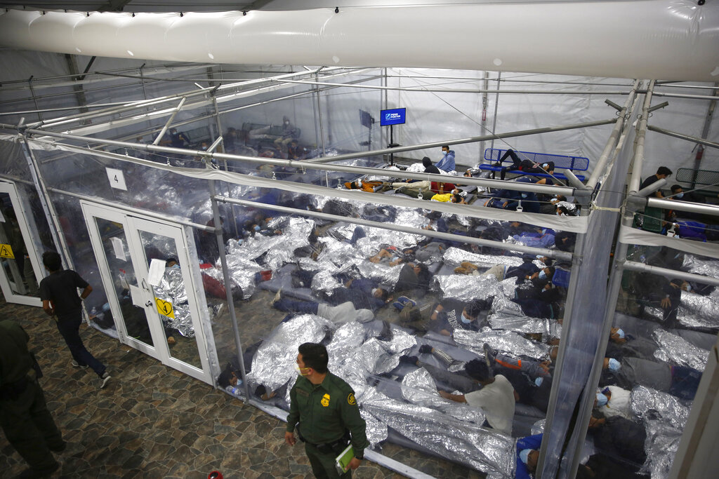 In this March 30, 2021, file photo, minors are shown inside a pod at the Donna Department of Homeland Security holding facility, the main detention center for unaccompanied children in the Rio Grande Valley run by U.S. Customs and Border Protection (CBP), in Donna, Texas. (AP Photo/Dario Lopez-Mills, Pool,File)