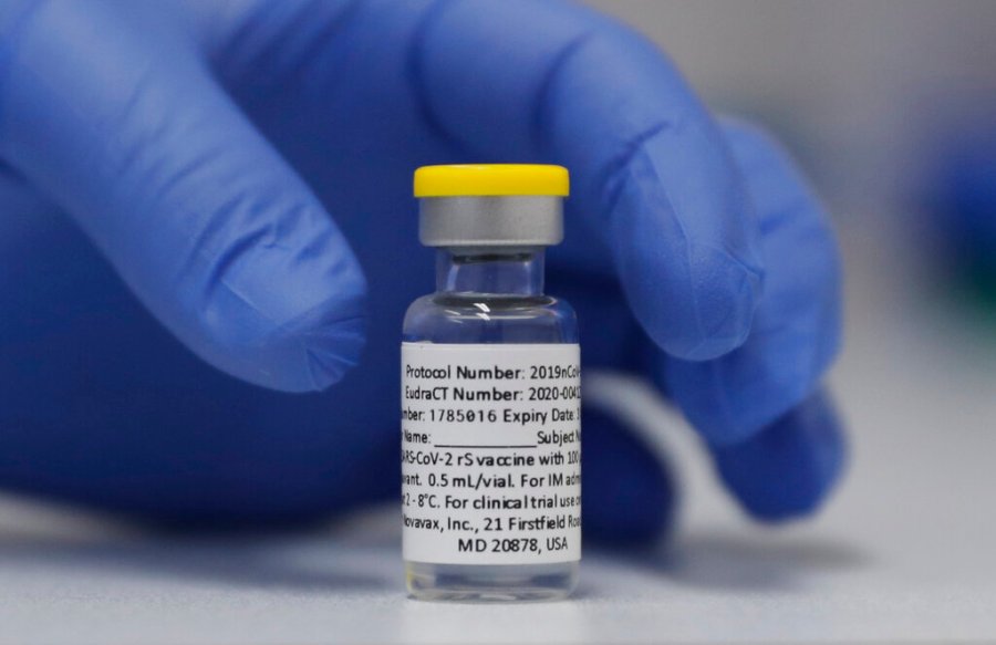 In this Wednesday, Oct. 7, 2020, file photo, a vial of the Phase 3 Novavax coronavirus vaccine is seen ready for use in the trial at St. George's University hospital in London. (AP Photo/Alastair Grant, File)