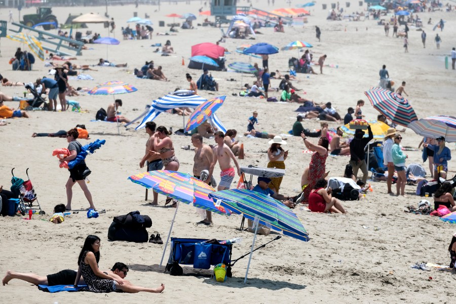 Beachgoers try to beat the heat at Santa Monica Beach on Wednesday, June 16, 2021, in Santa Monica, Calif. (AP Photo/Ringo H.W. Chiu)