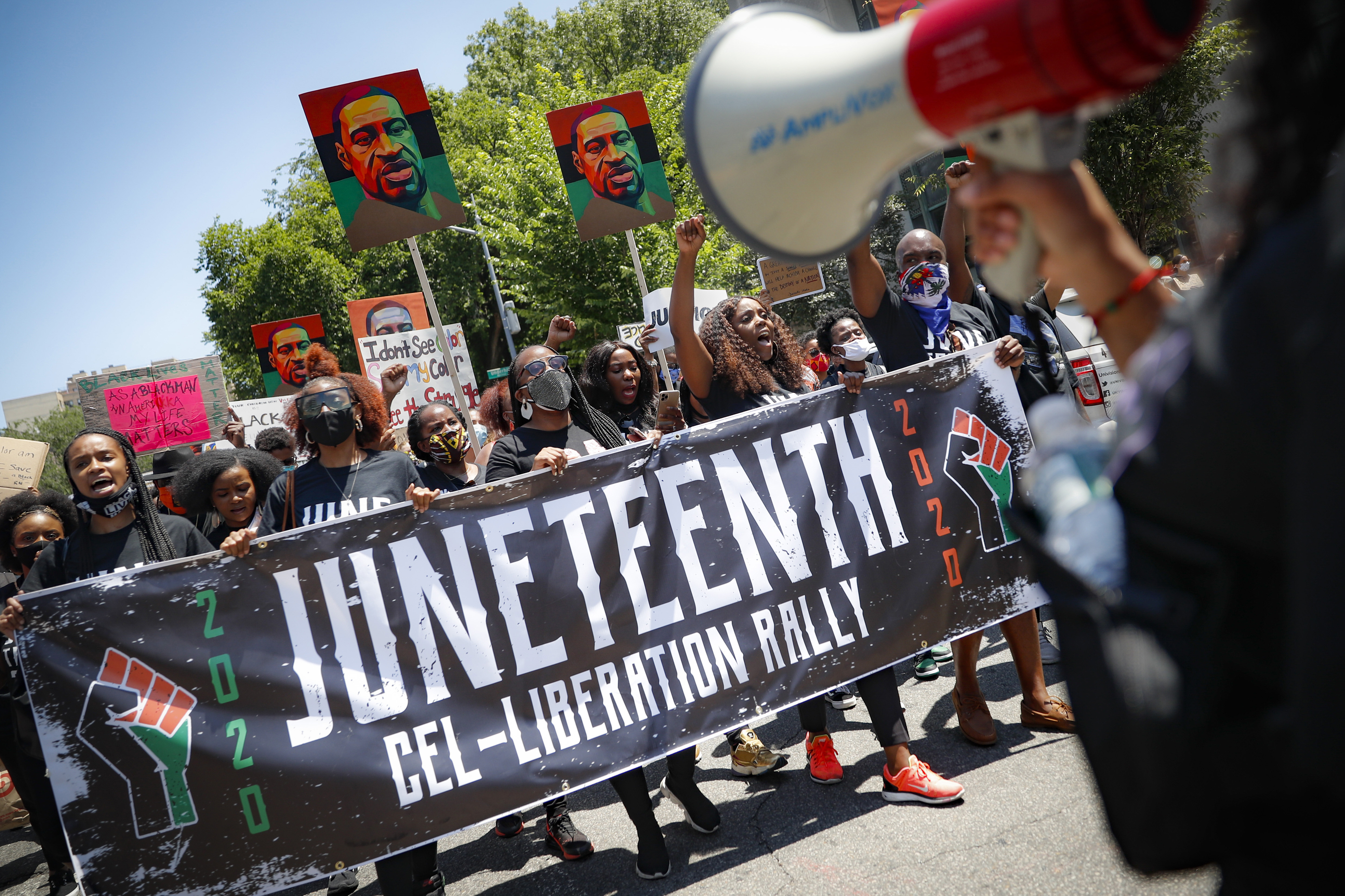 In this June 19, 2020, file photo, protesters chant as they march after a Juneteenth rally at the Brooklyn Museum. (John Minchillo/Associated Press)